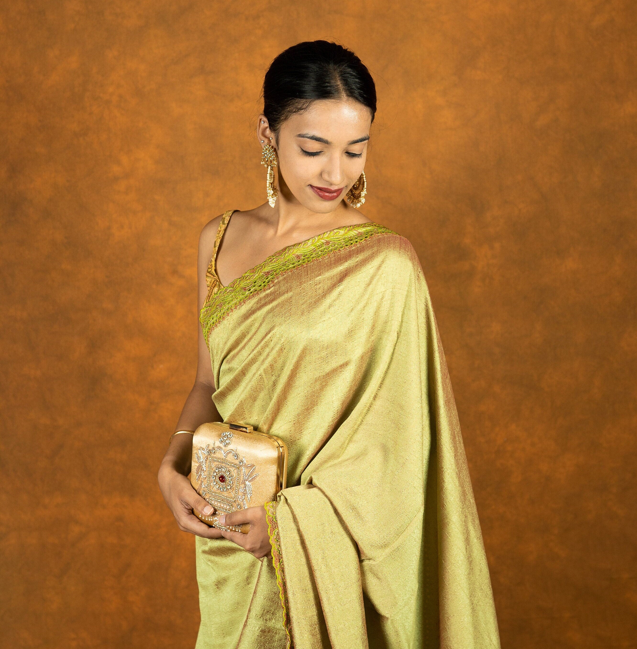 Green chinnon silk cutwork embroidered saree