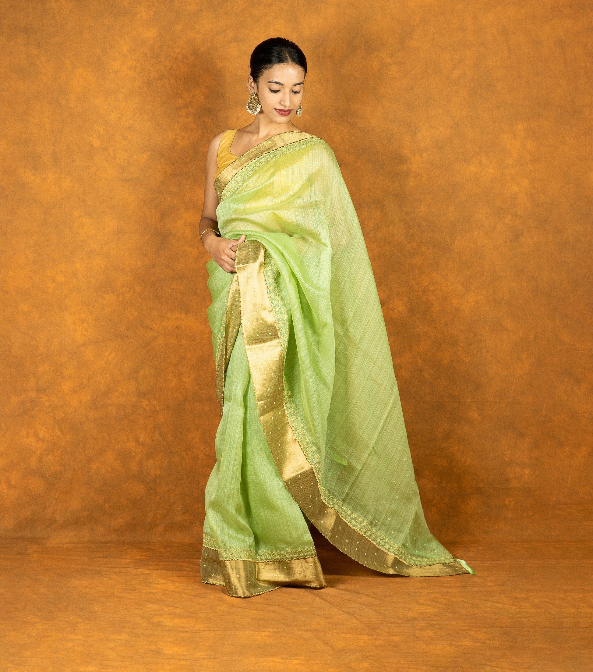Green linen silk blend zari embroidered saree