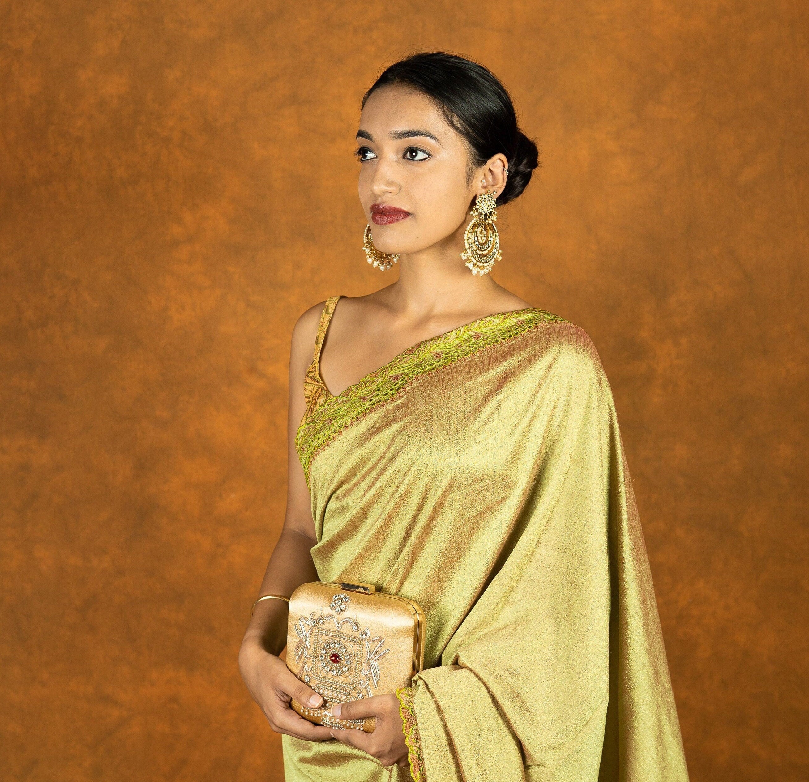 Green chinnon silk cutwork embroidered saree