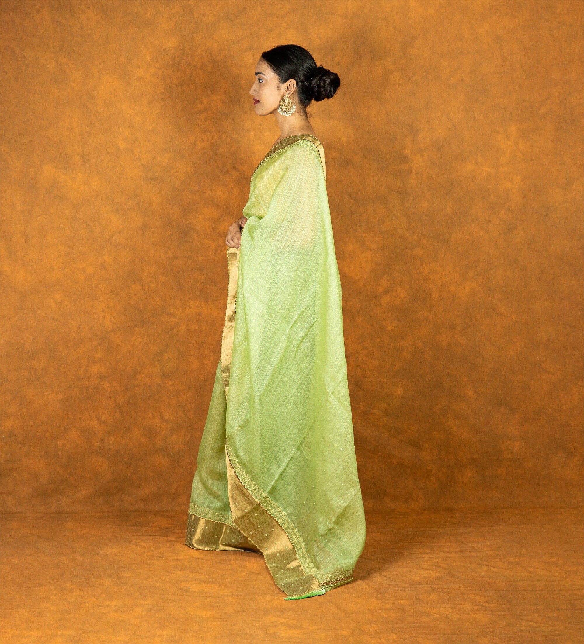 Green linen silk blend zari embroidered saree