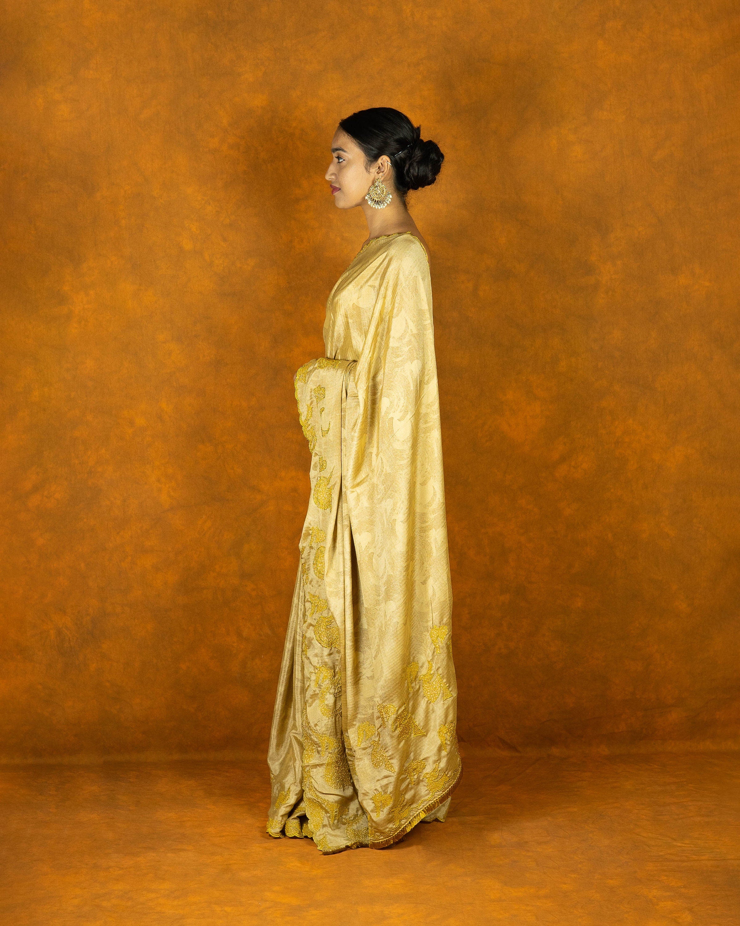 Yellow gold chinon silk embroidery design saree with tassels, festive designer saree