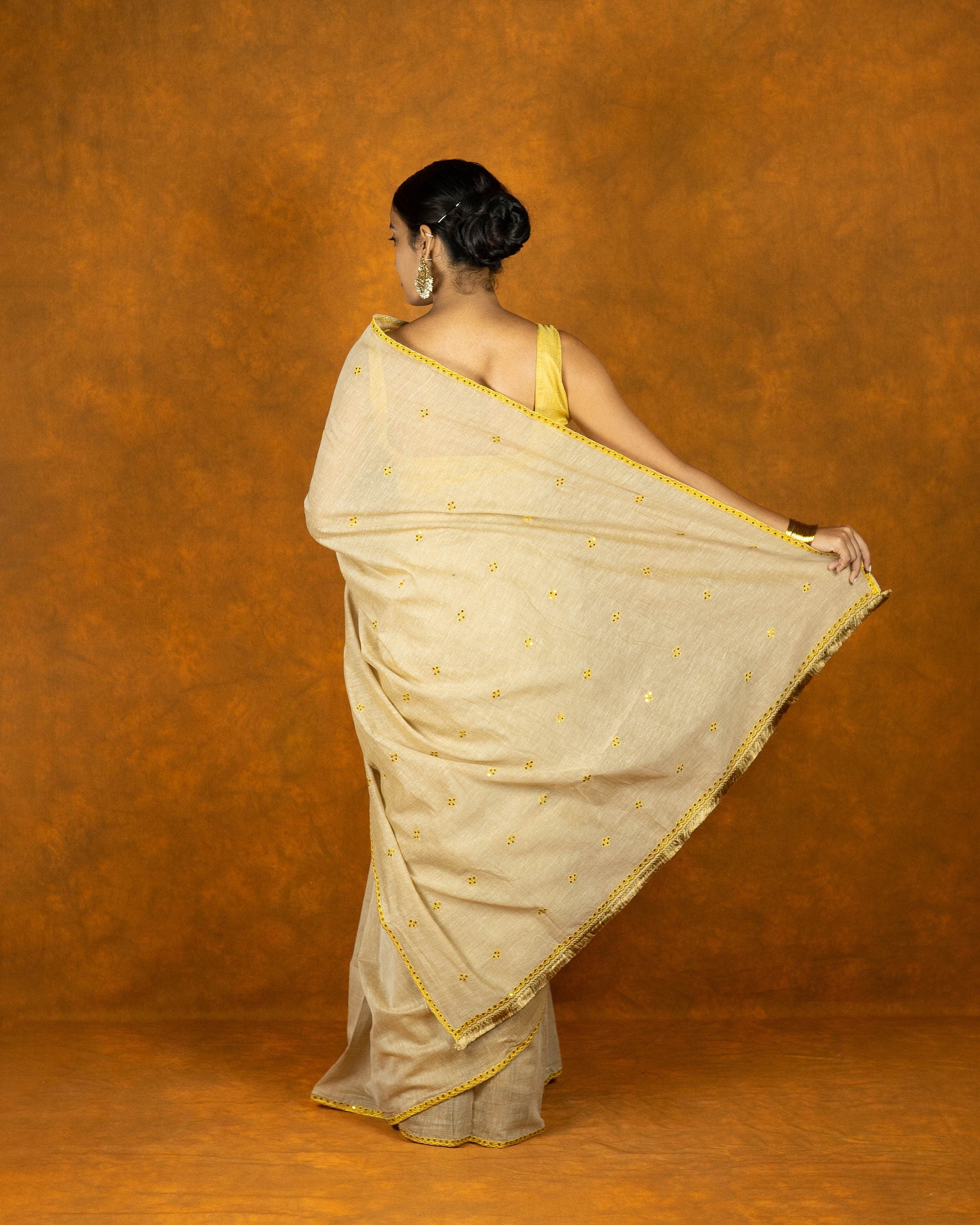 Beige and yellow gold zari embroidery saree