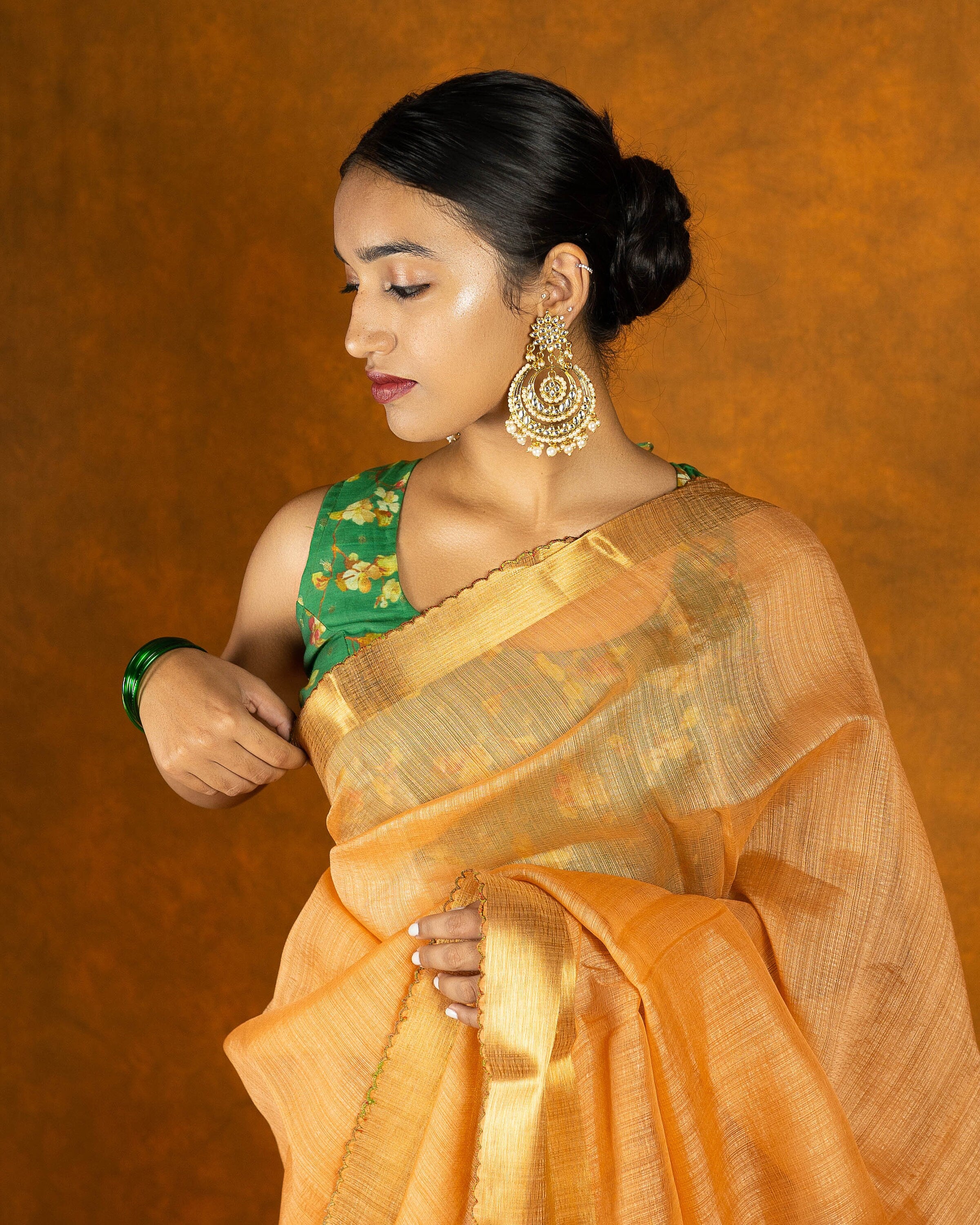 Peach Orange embroidery mirror-work saree with gold border and tassels