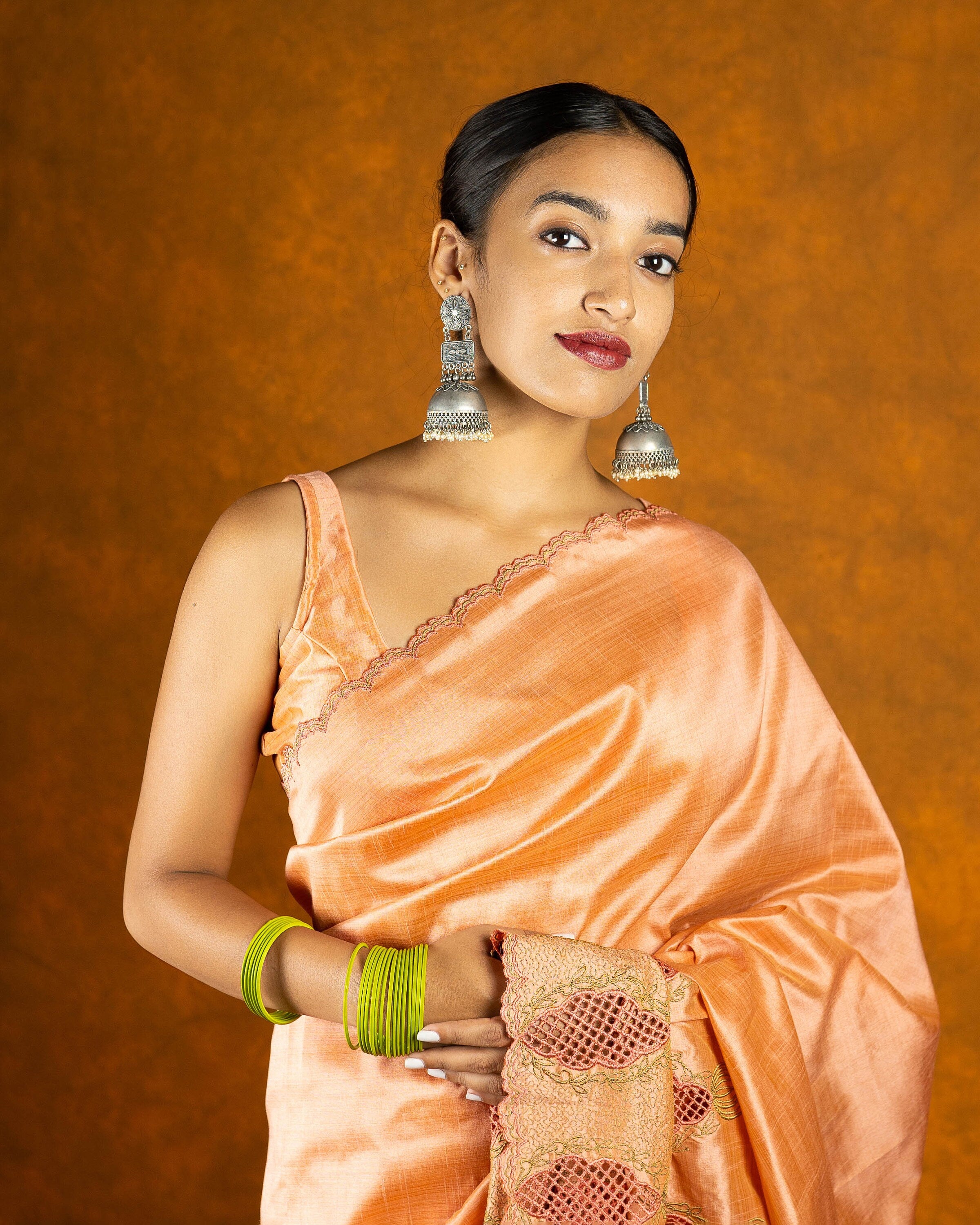 Peach cutwork embroidery saree with tassels