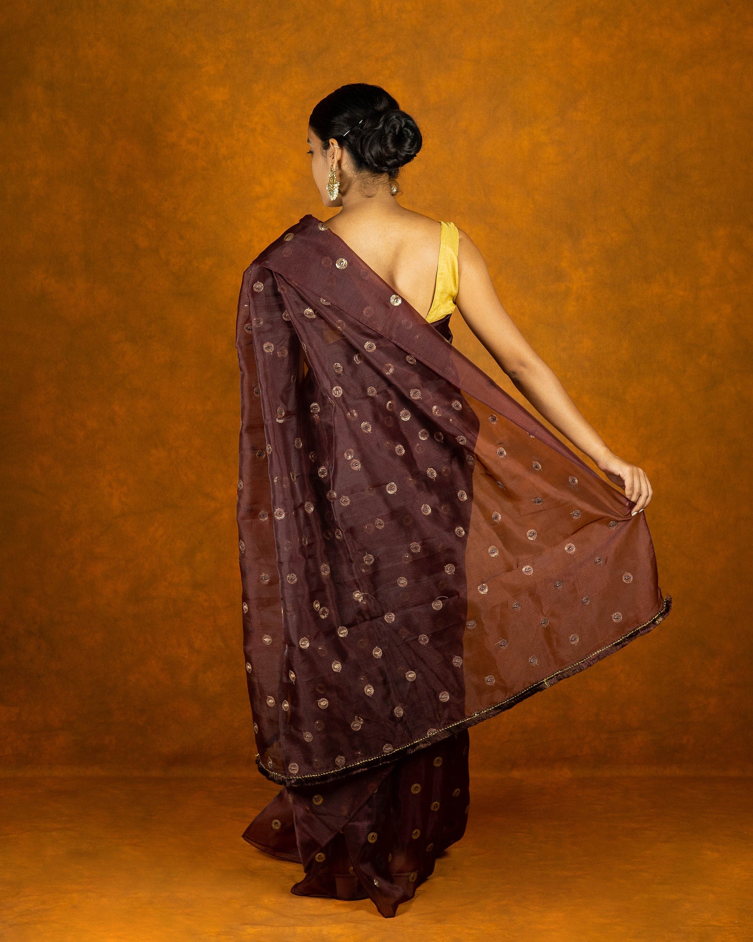 Grape Organza blend embroidery saree with gold work border and tassels