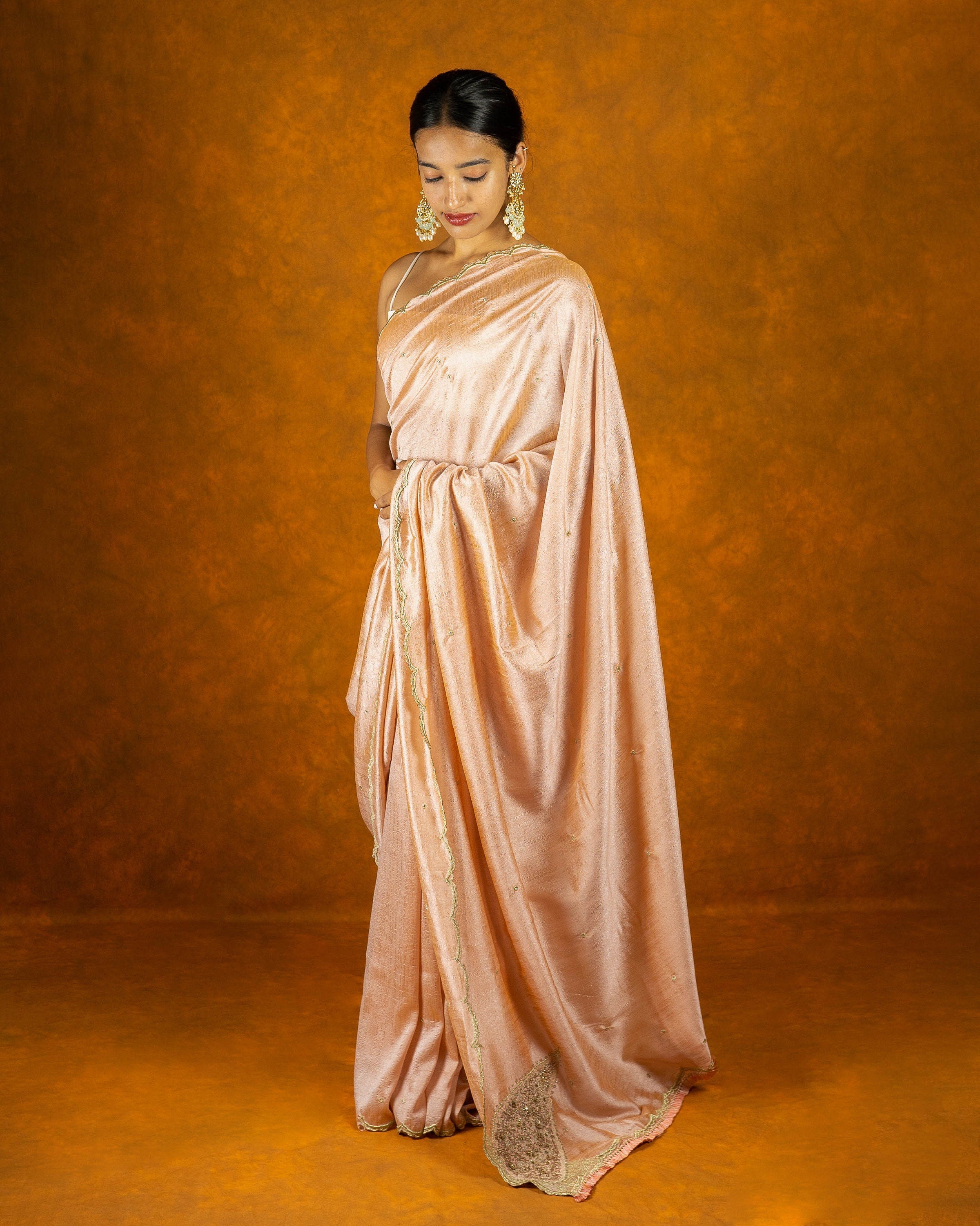 Peach chinon silk blend embroidery saree with crystal  and butta work border