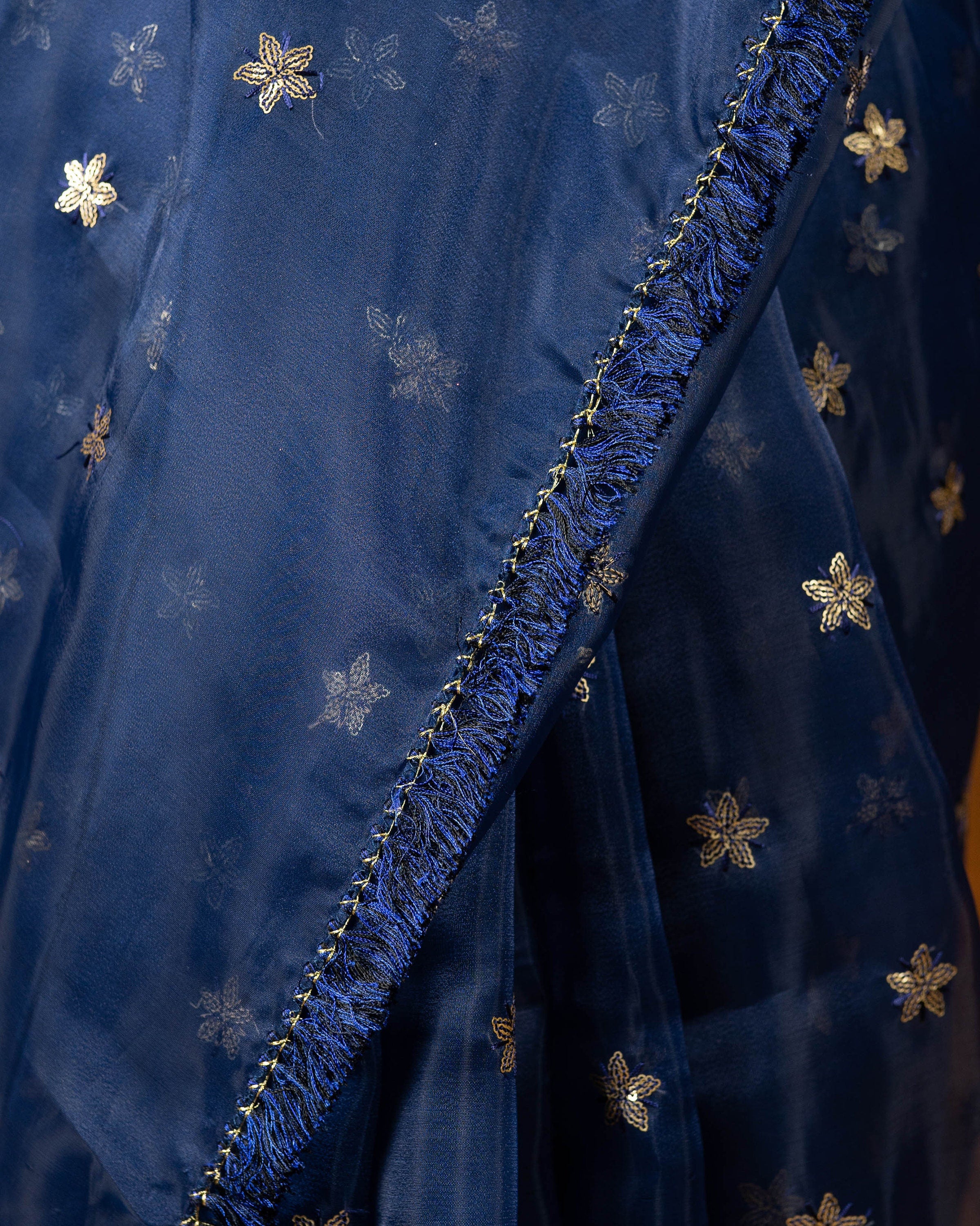 Royal blue Organza blend embroidery saree with gold work border and tassels