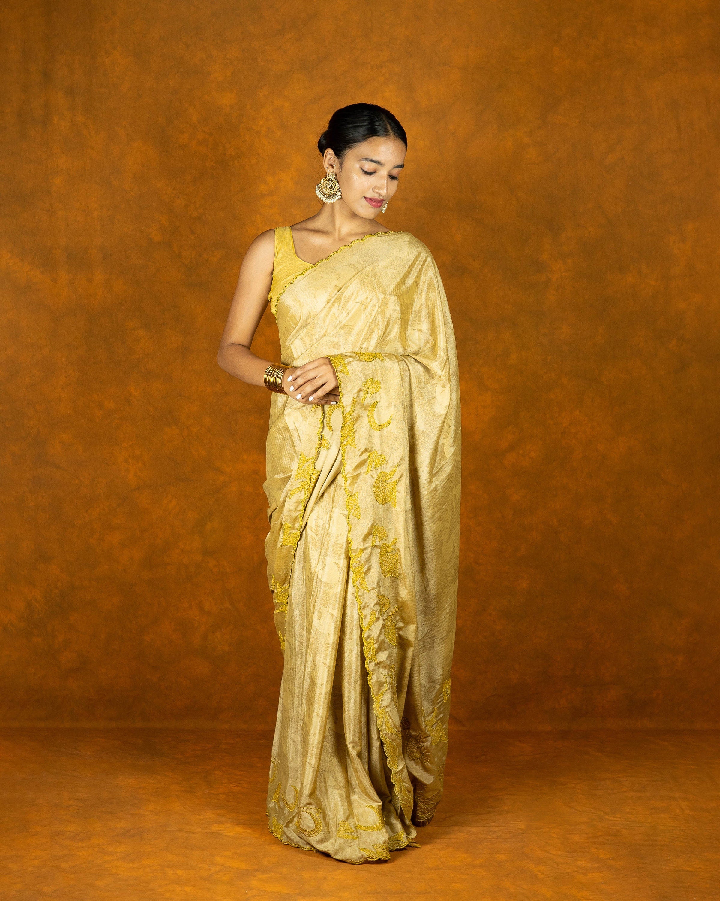 Yellow gold chinon silk embroidery design saree with tassels, festive designer saree