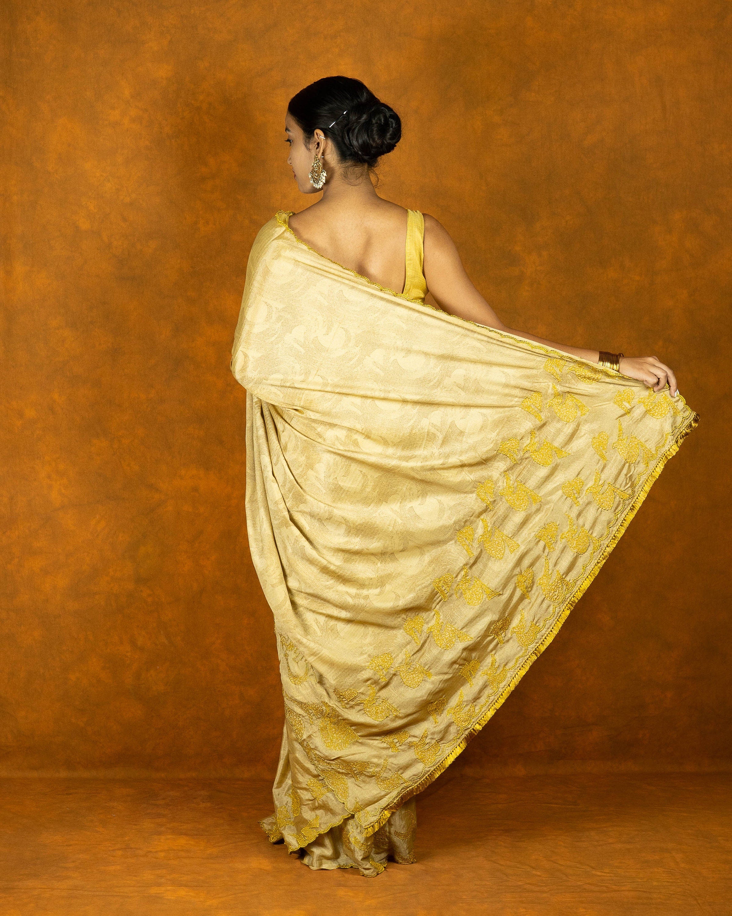 Yellow gold chinon silk embroidery design saree with tassels, festive designer saree