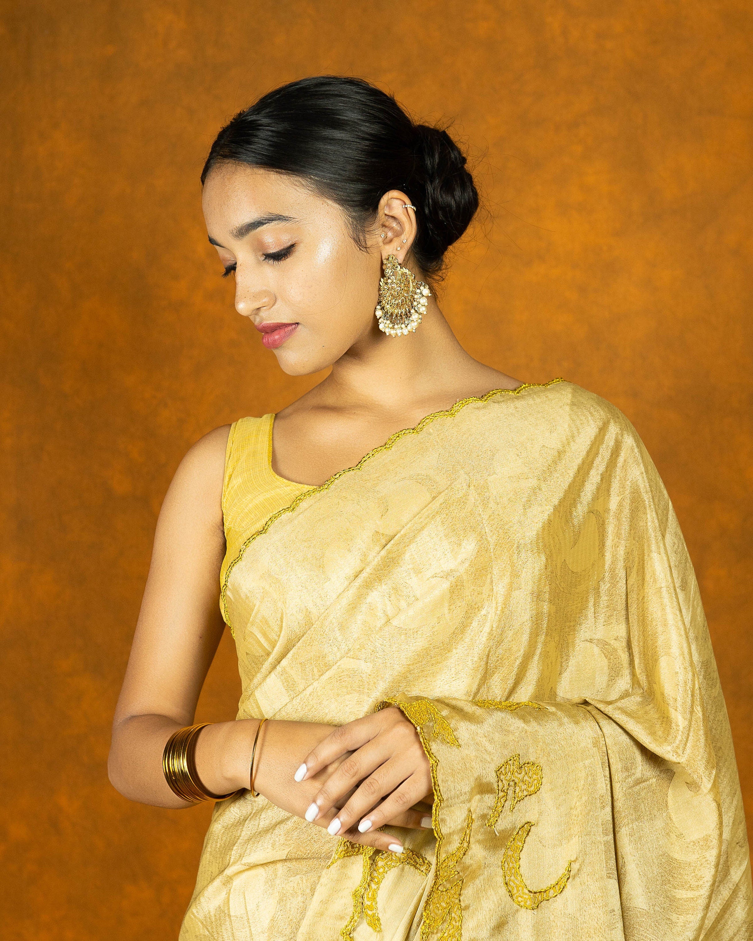 Yellow gold chinon silk embroidery design saree with tassels, festive designer saree