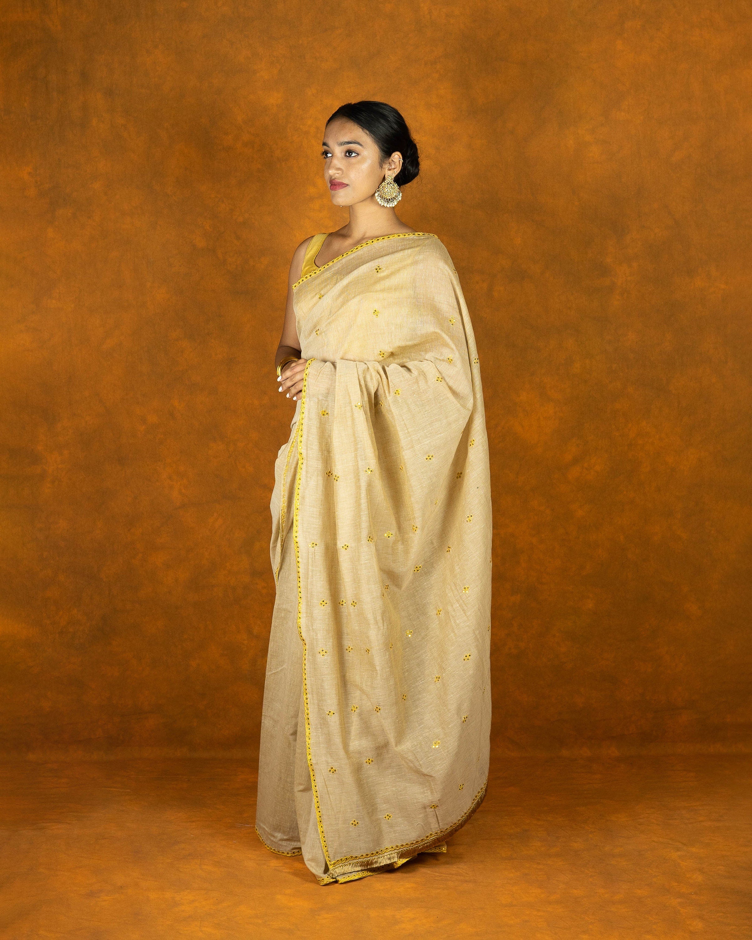 Beige and yellow gold zari embroidery saree