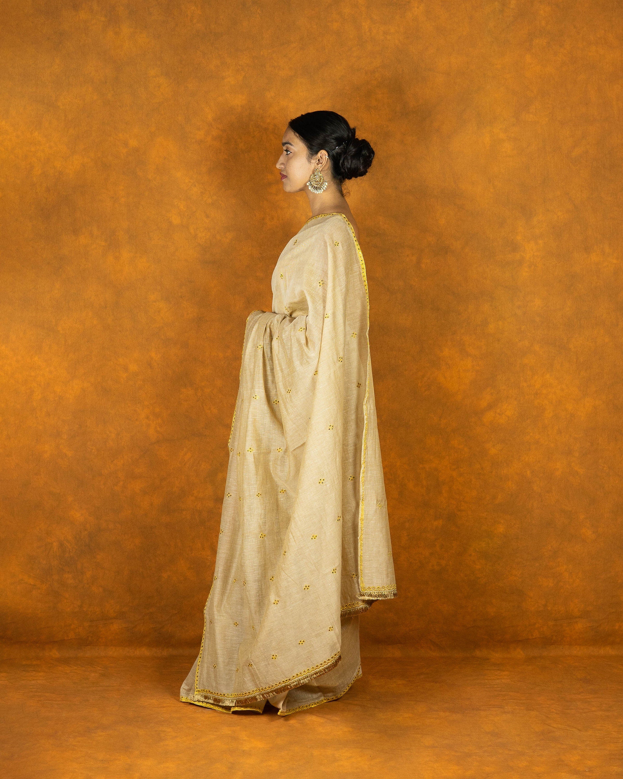 Beige and yellow gold zari embroidery saree
