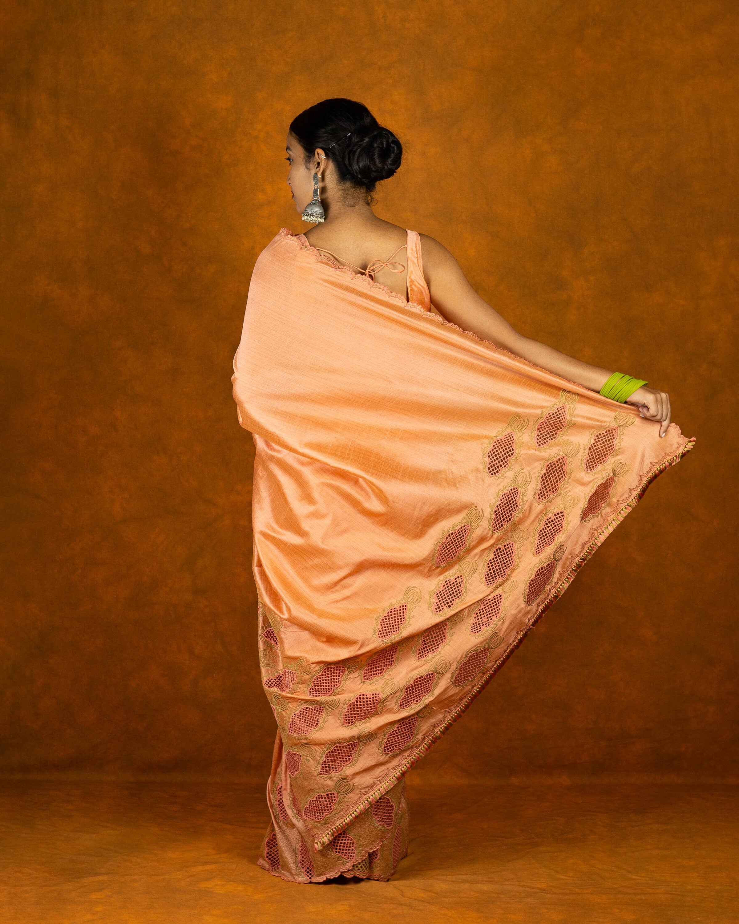 Peach cutwork embroidery saree with tassels