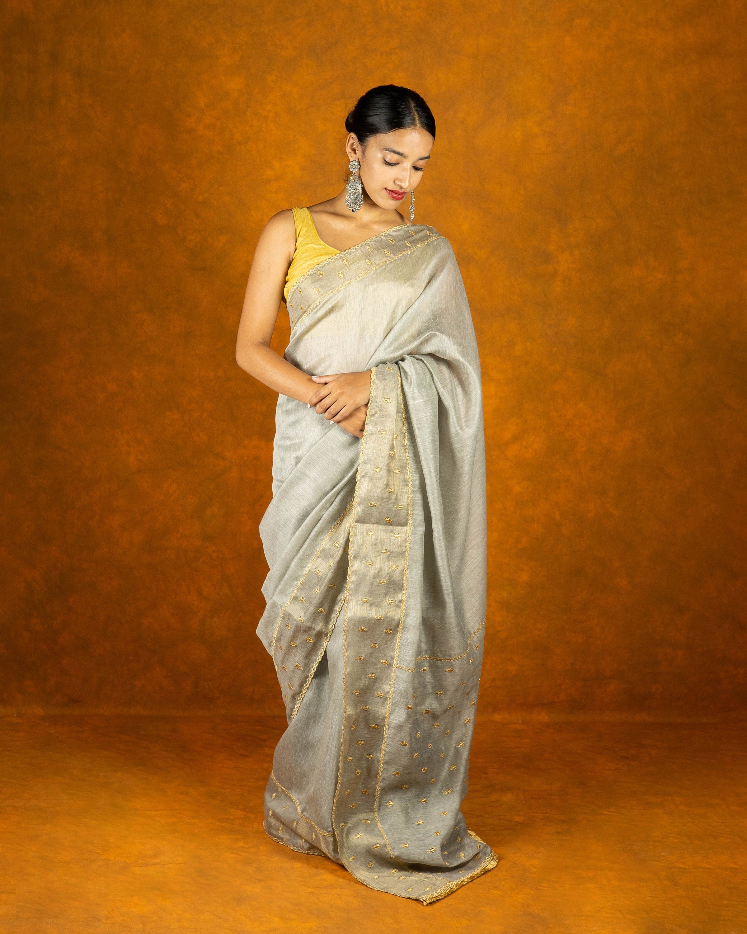Gray cotton embroidery saree with gold work borde