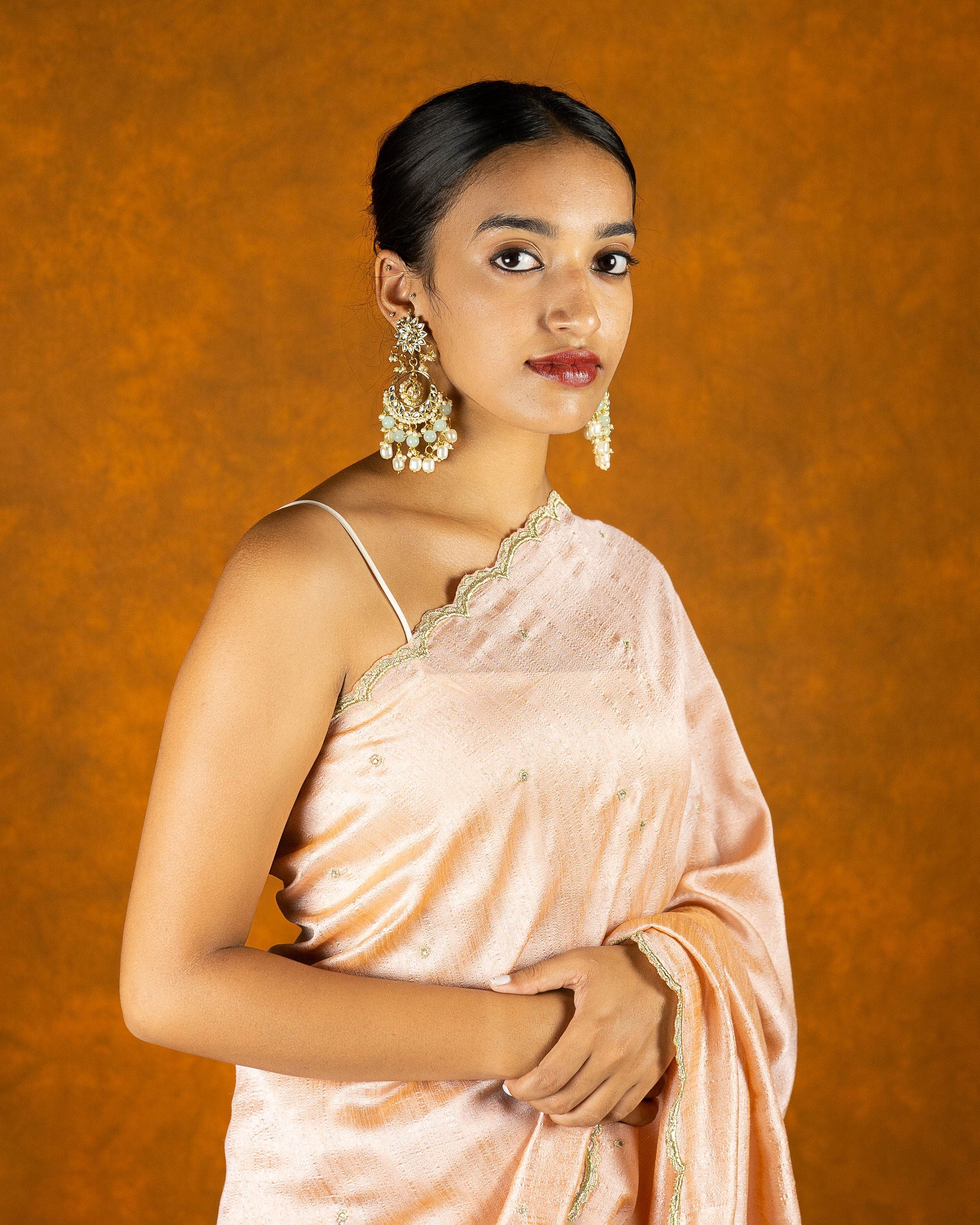 Peach chinon silk blend embroidery saree with crystal and butta work border