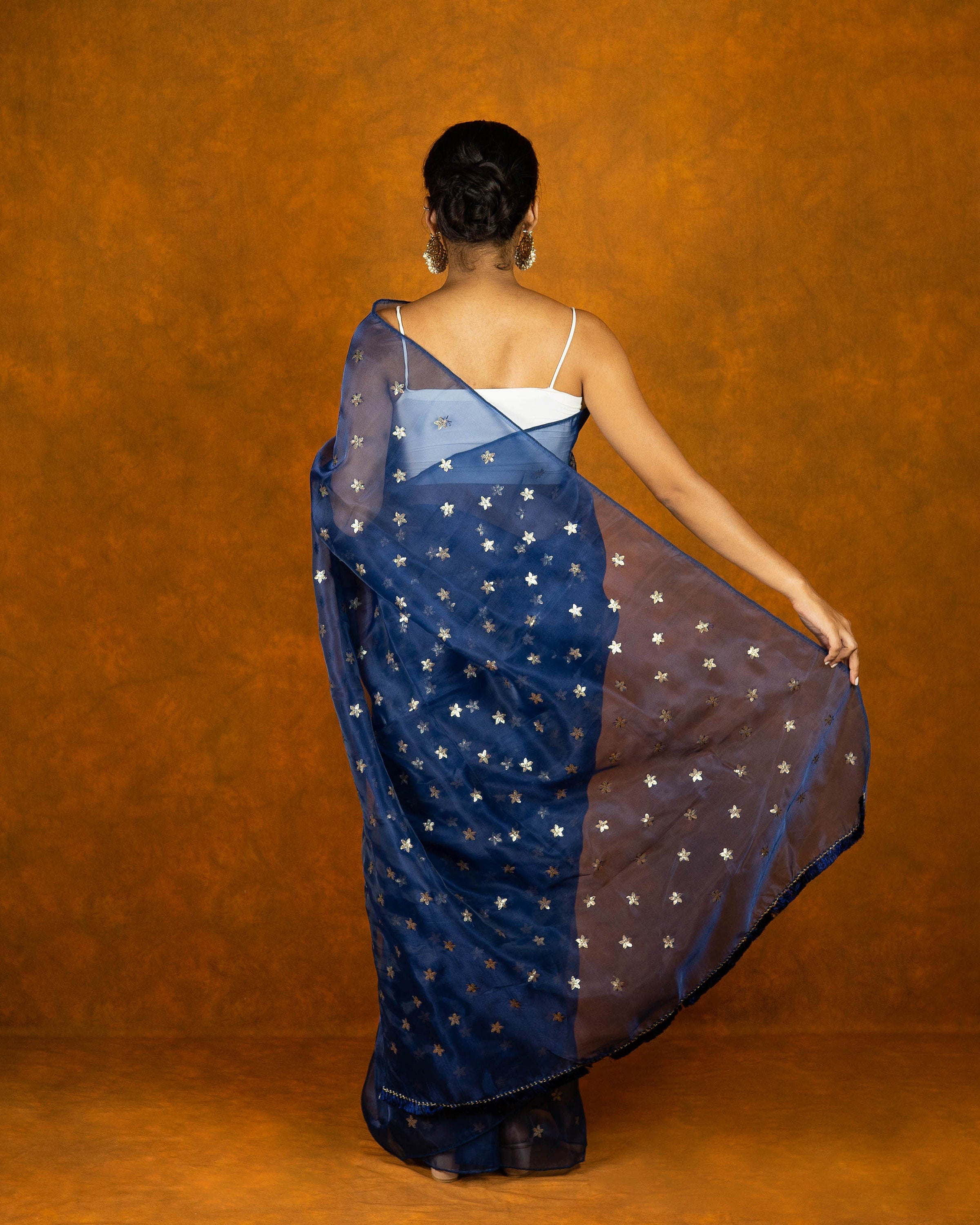 Royal blue Organza blend embroidery saree with gold work border and tassels