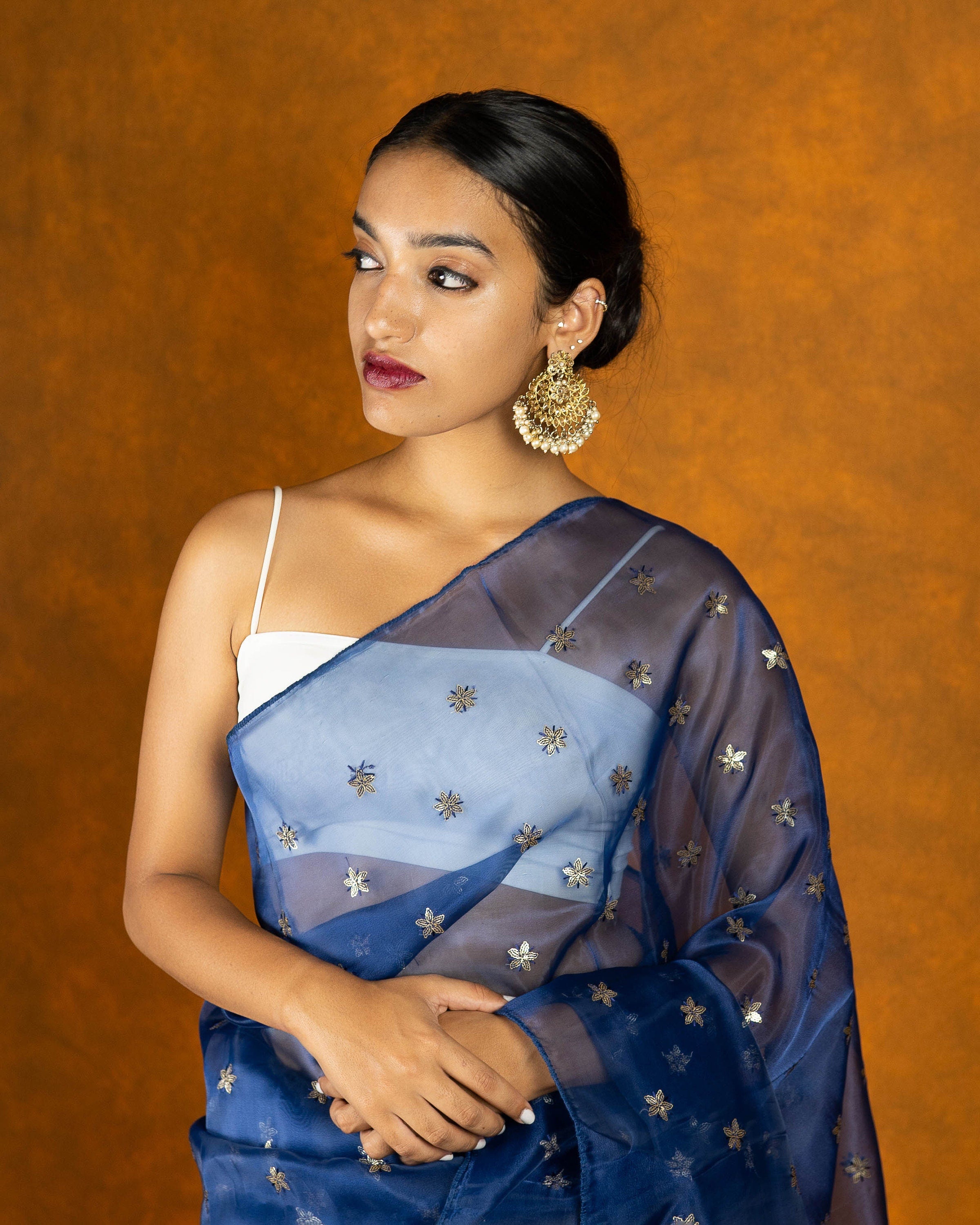 Royal blue Organza blend embroidery saree with gold work border and tassels