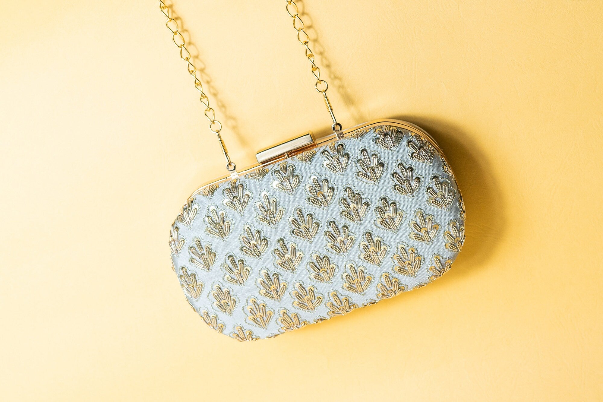 Gray metal embroidery clutch bag with detachable sling