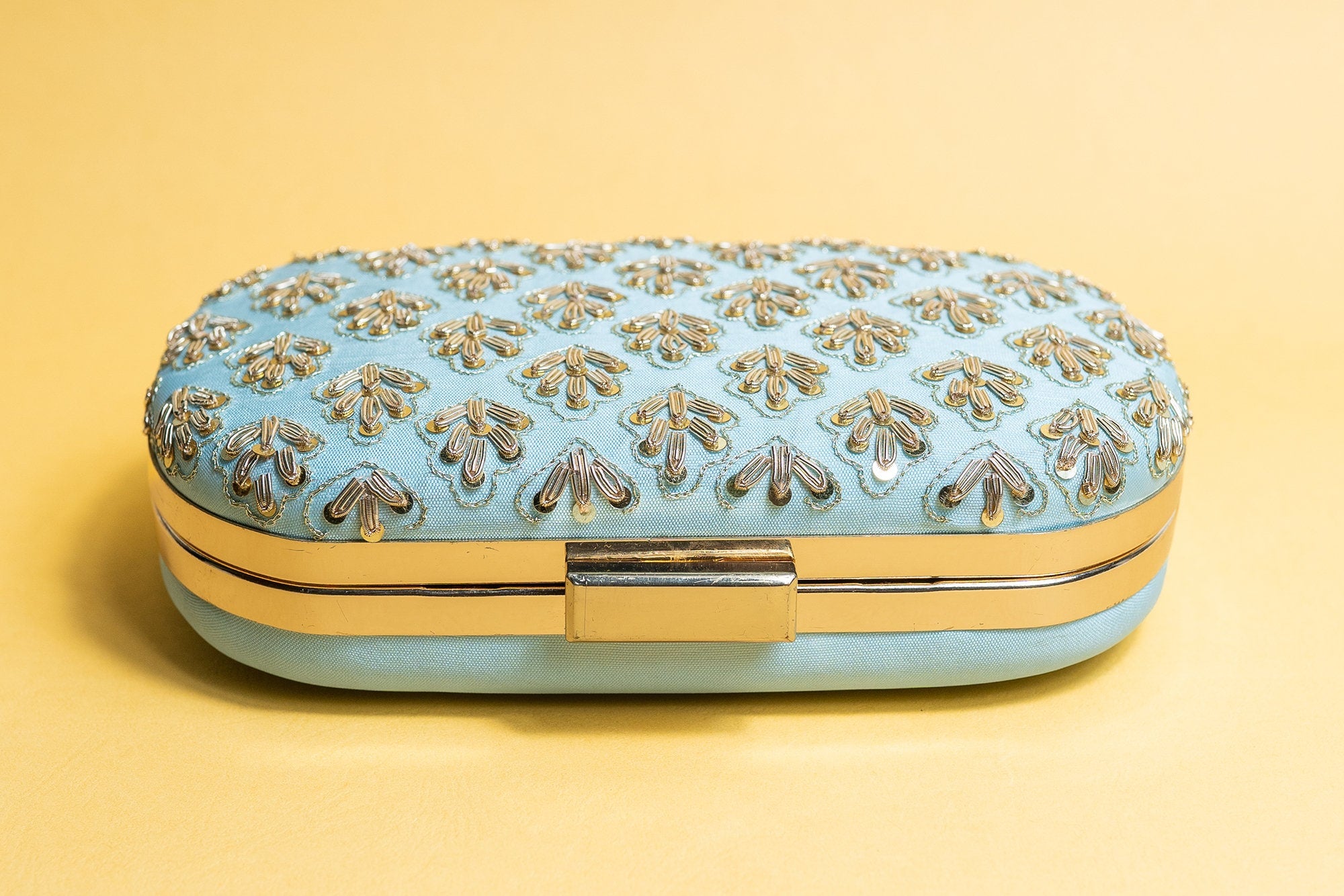 Powder blue metal embroidery clutch bag with detachable sling