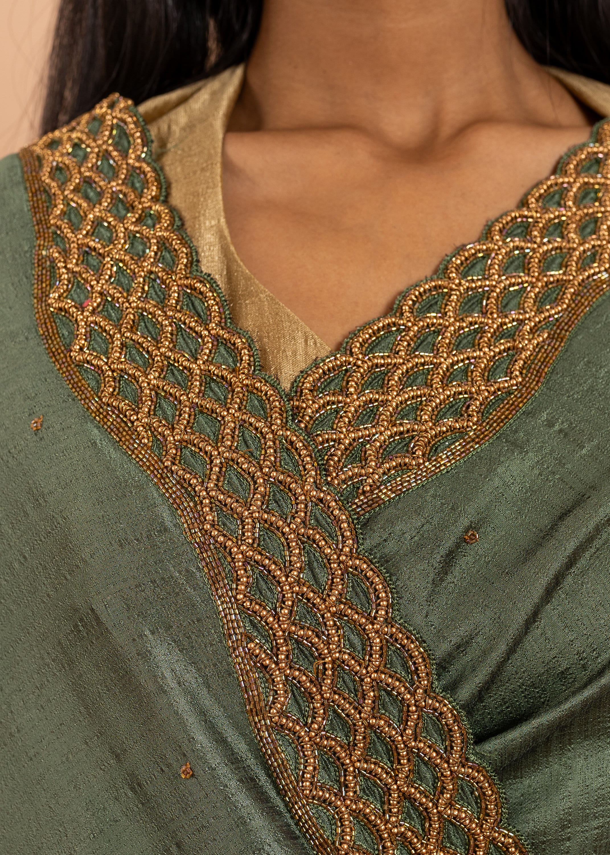 Green silk blend gold link chain handwork saree with gold work border and festive designer saree