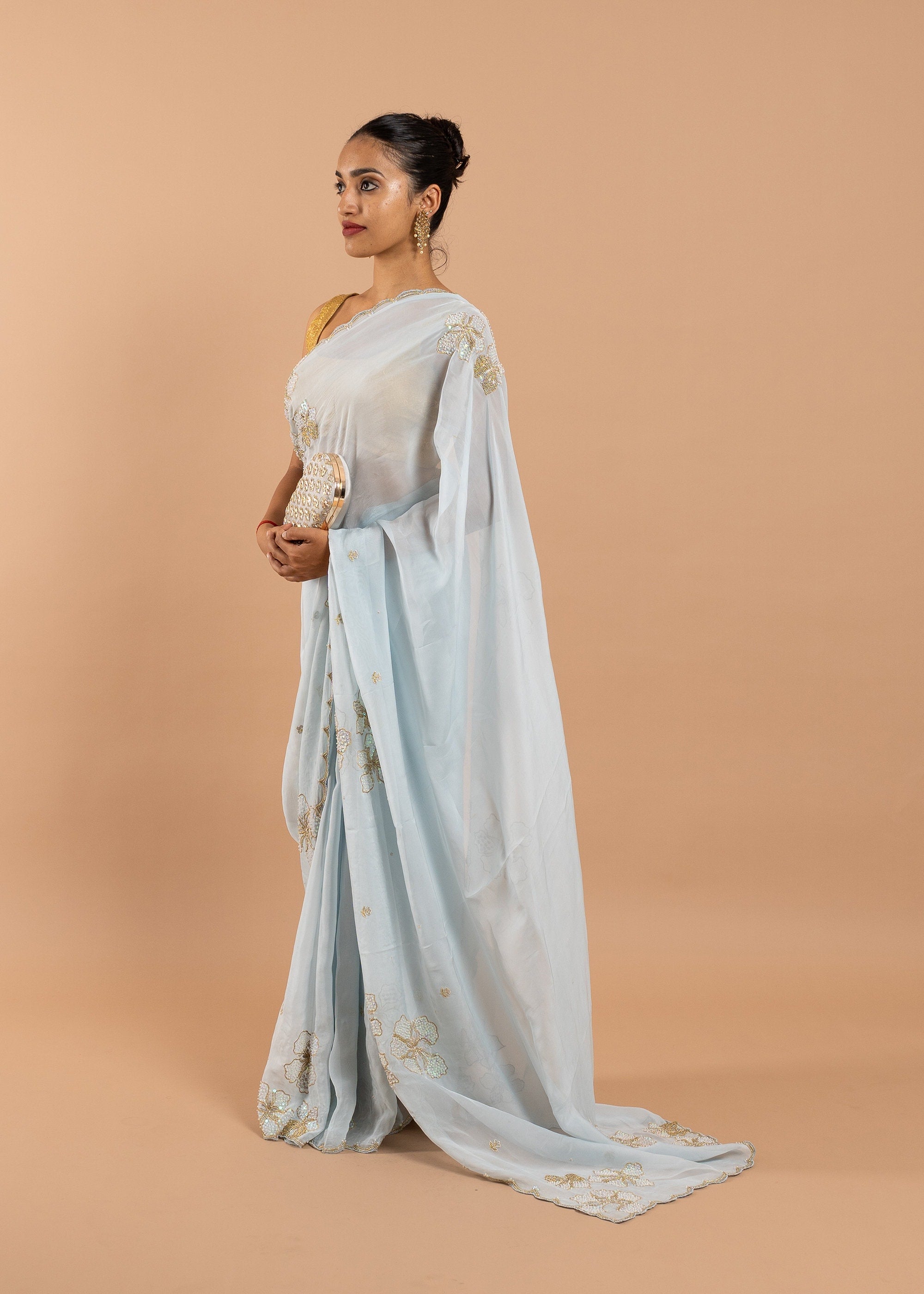 Blue organza saree with gold zari silk thread and beads handwork embroidery saree