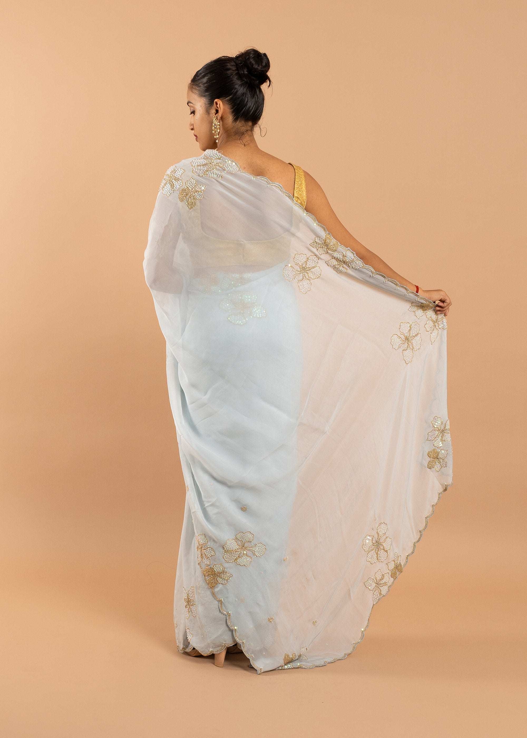 Blue organza saree with gold zari silk thread and beads handwork embroidery saree