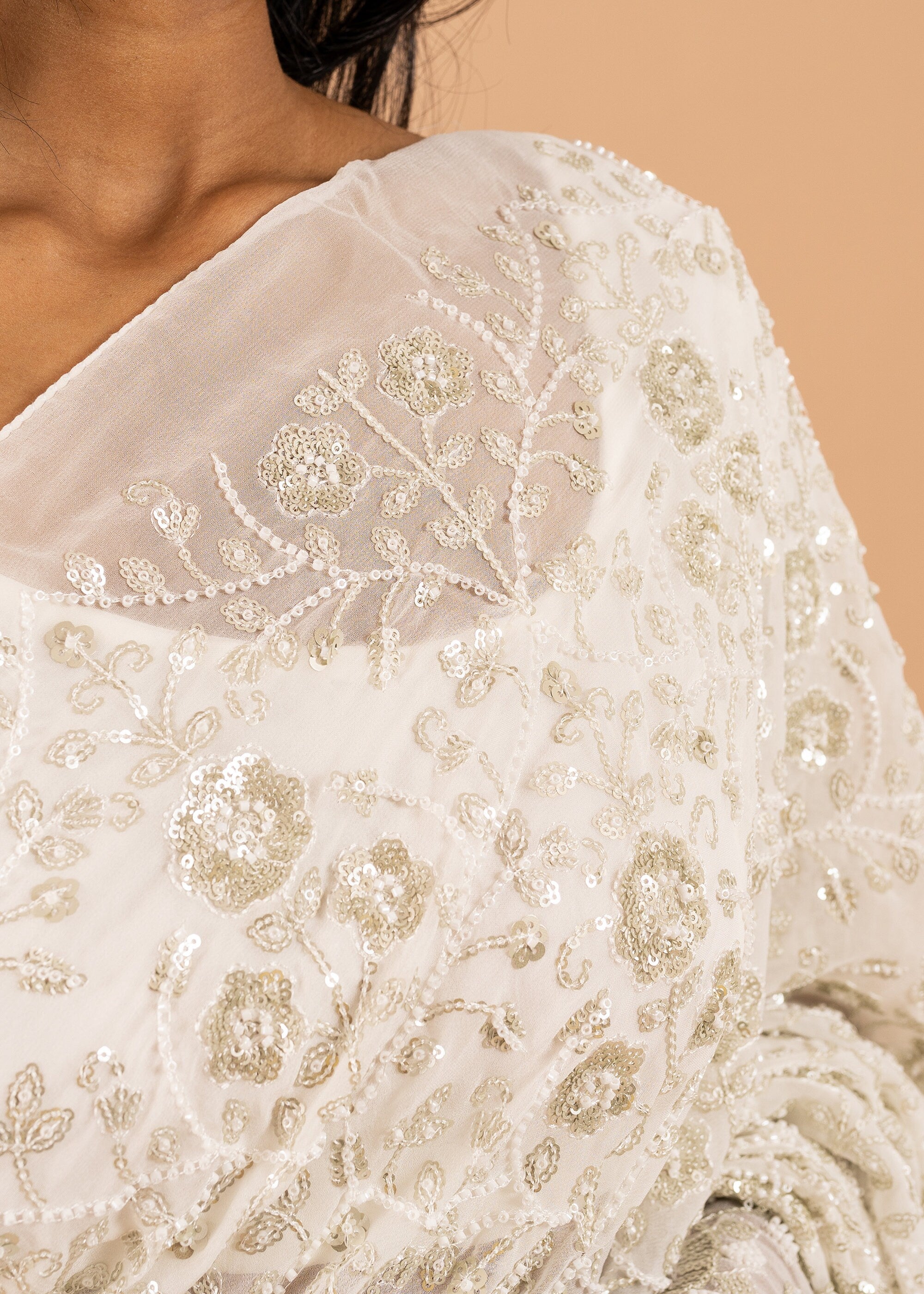 Ivory Georgette saree with white silk thread  and sequins handwork embroidery