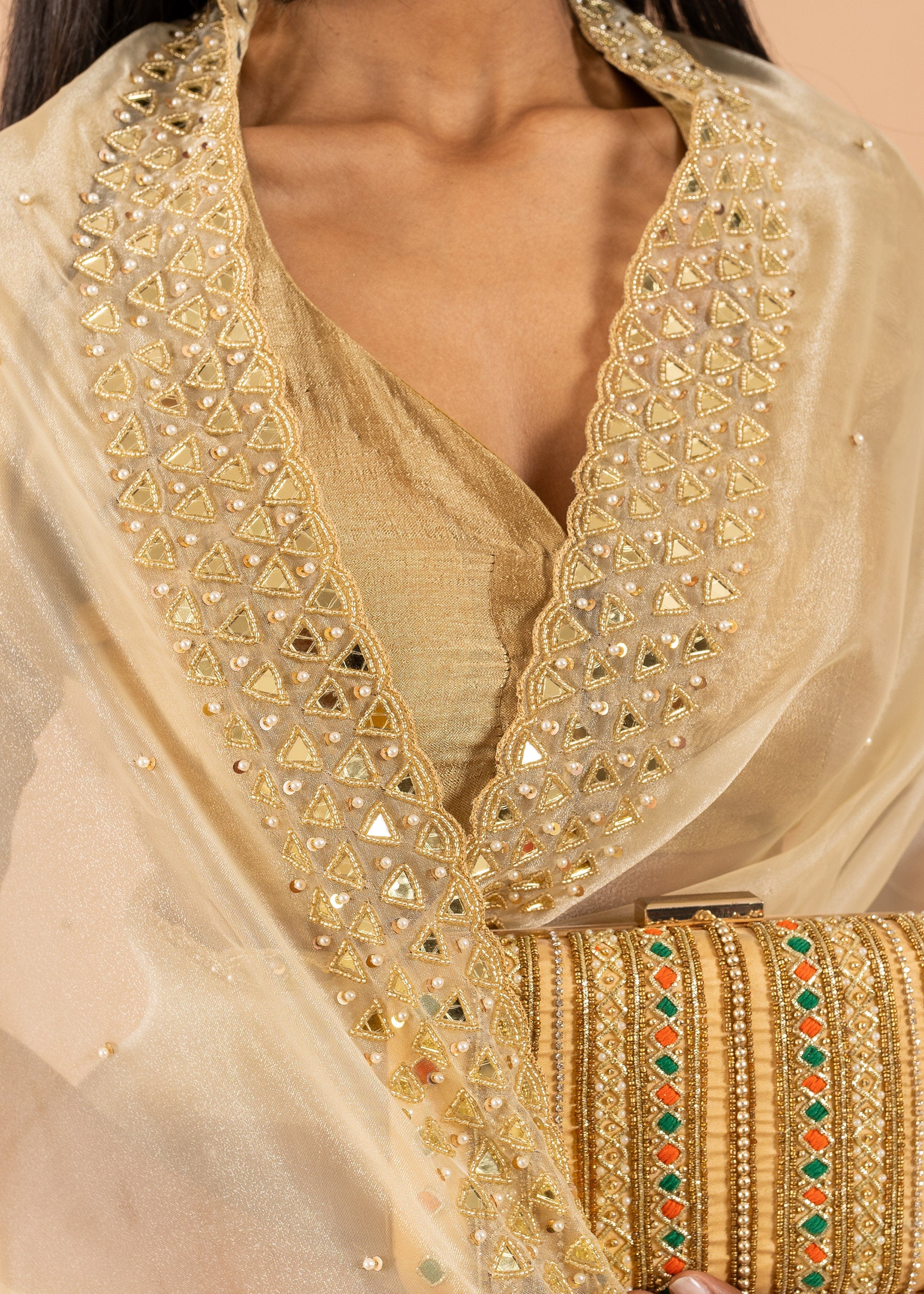 Gold Organza saree with gold glasswork thread and zari handwork and beads embroidery