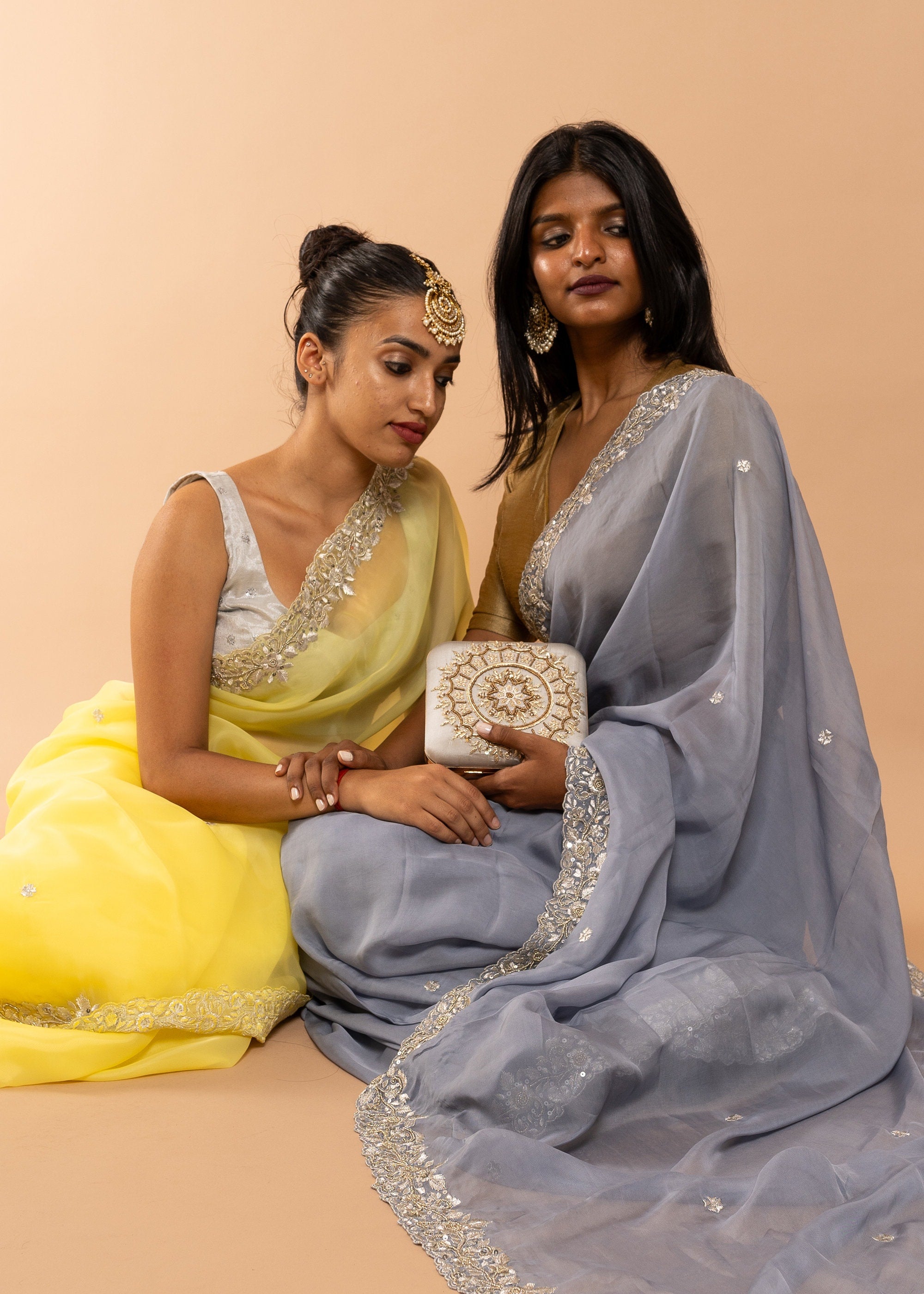 Yellow organza saree with zari silk thread and beads handwork embroidery
