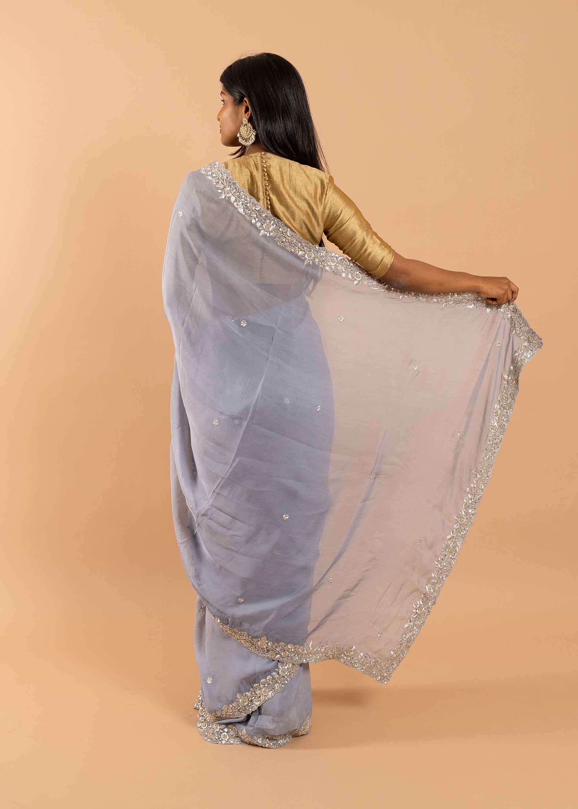Gray organza saree with zari silk thread and beads handwork embroidery