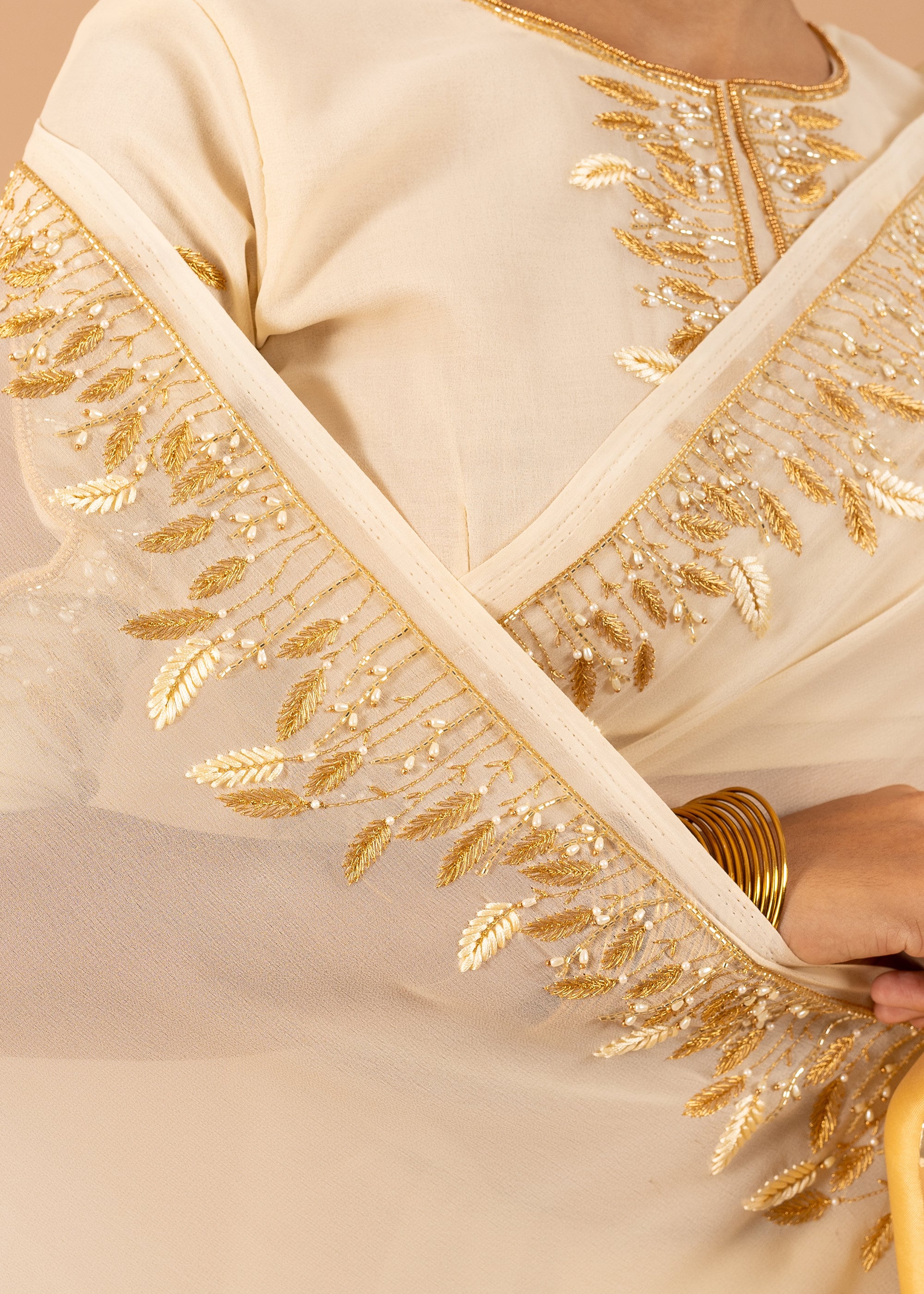 Cream georgette saree with silk thread  and beads handwork embroidery