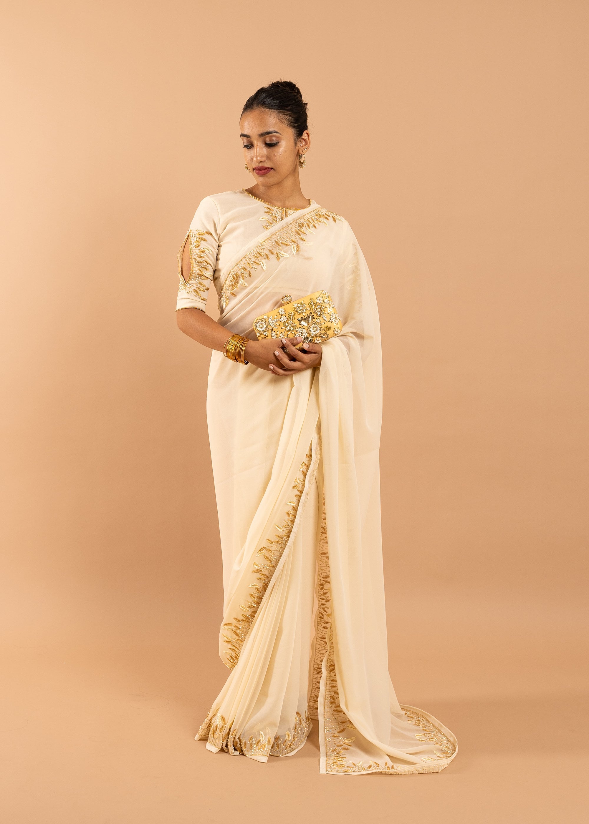 Cream georgette saree with silk thread  and beads handwork embroidery