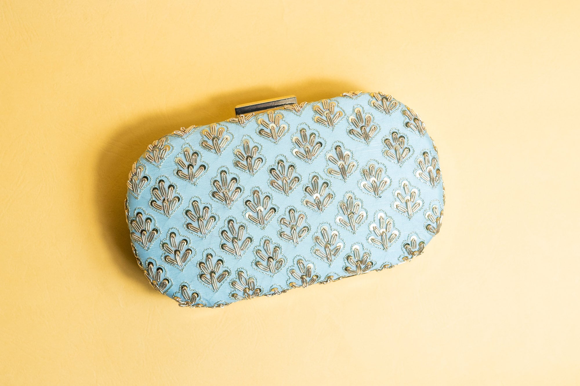 Powder blue metal embroidery clutch bag with detachable sling