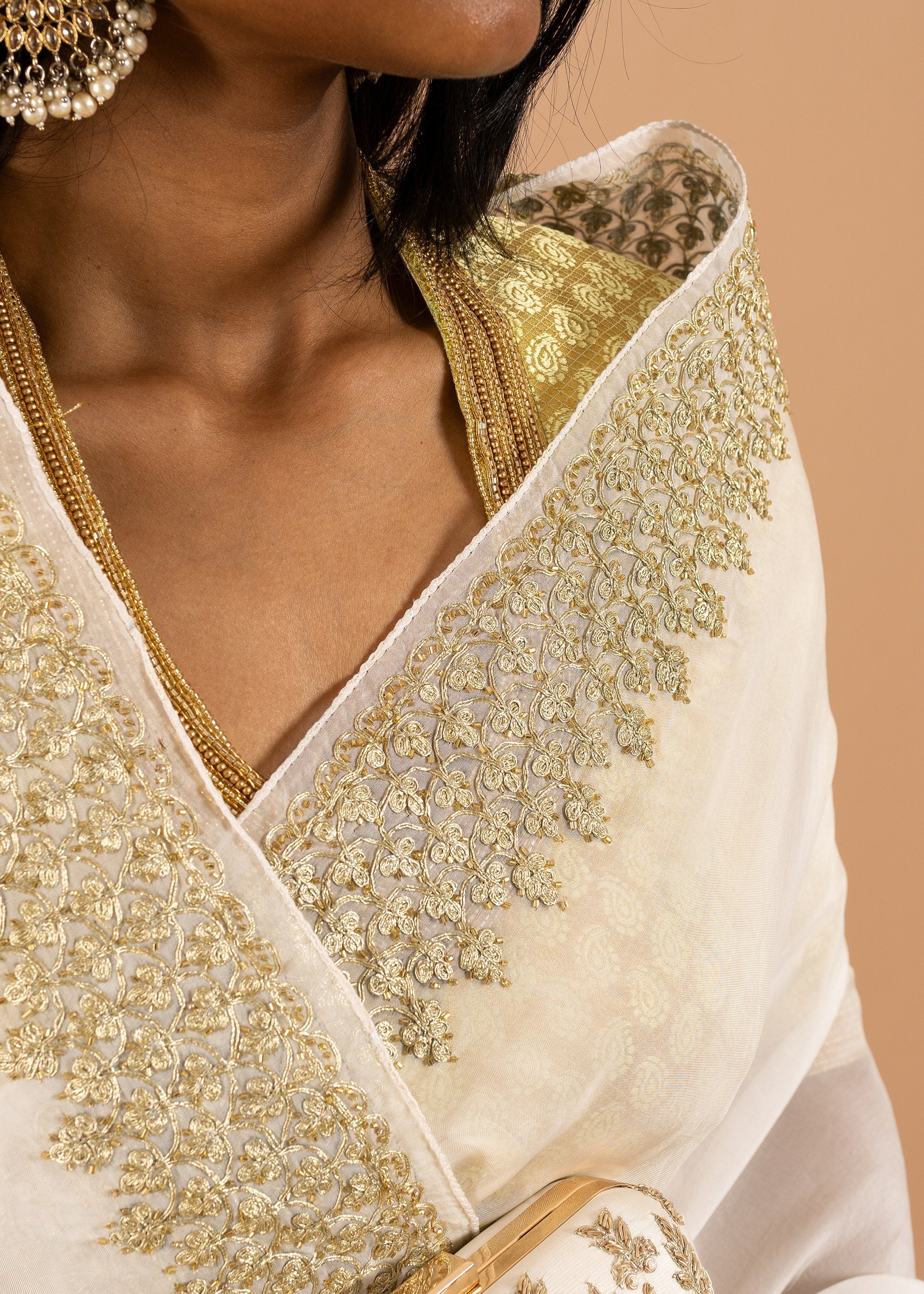 White/ivory organza saree with silk thread and gold wire and beads handwork embroidery