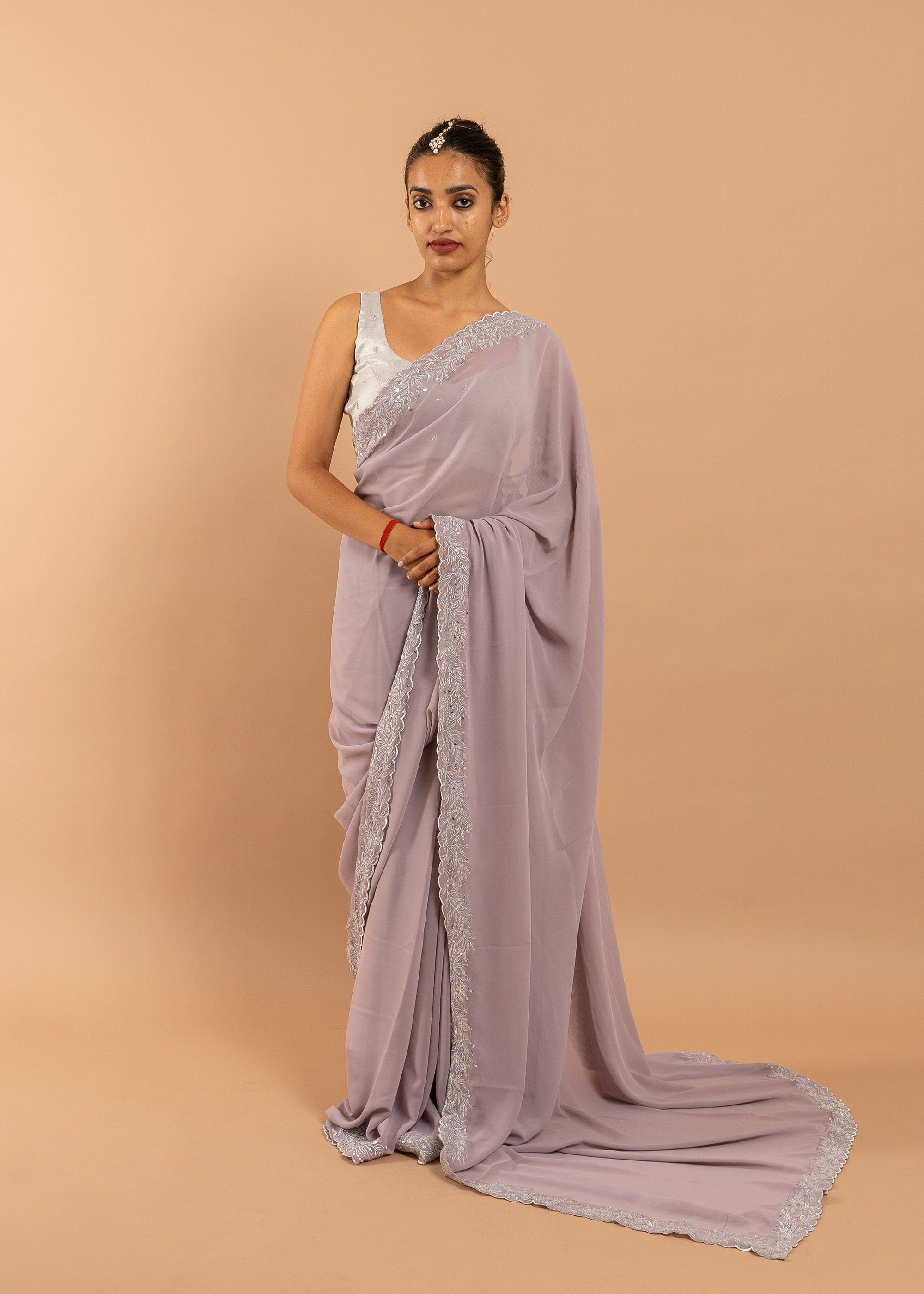 Lavender Georgette saree with silk thread and zari handwork and beads embroidery