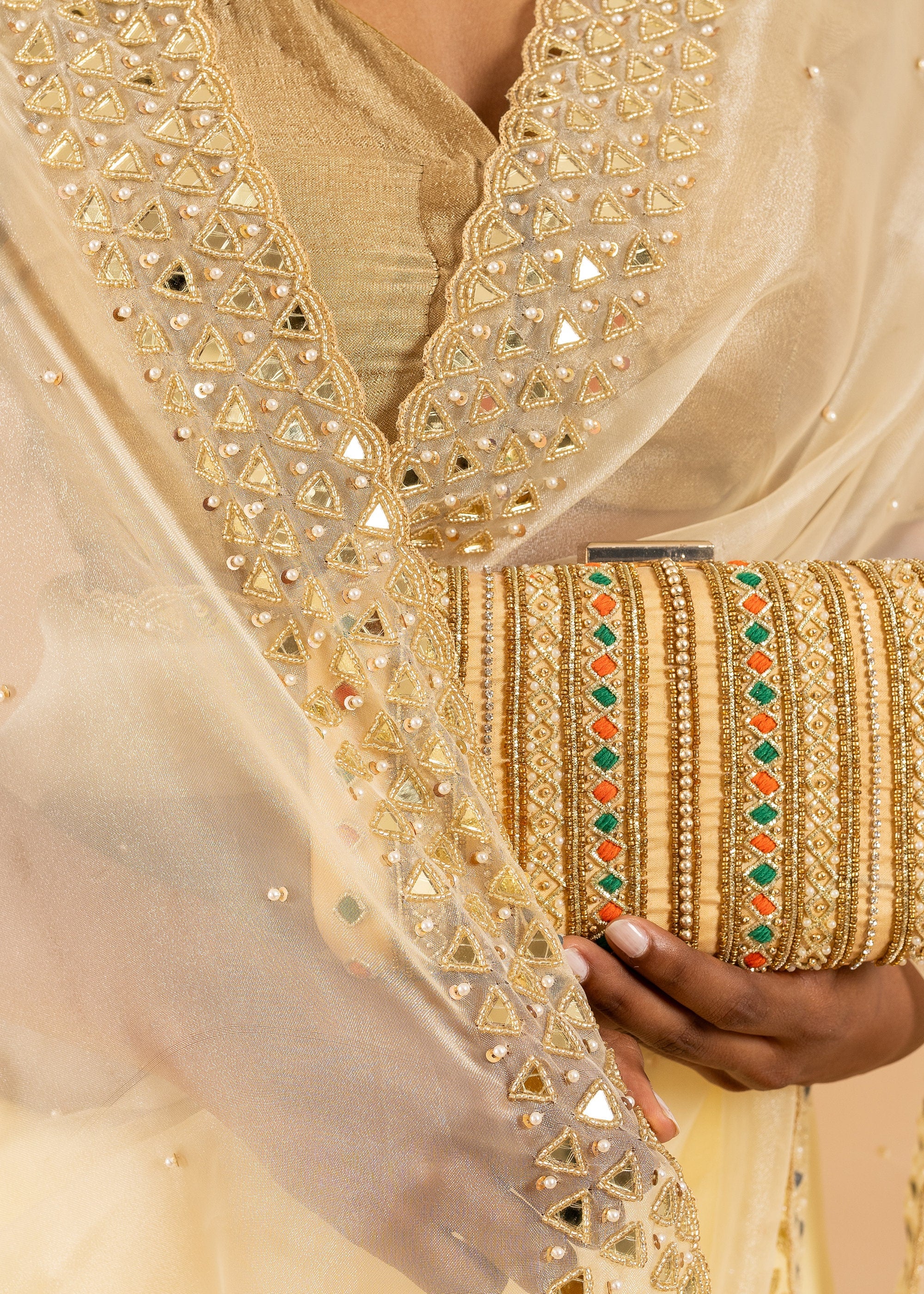 Gold Organza saree with gold glasswork thread and zari handwork and beads embroidery