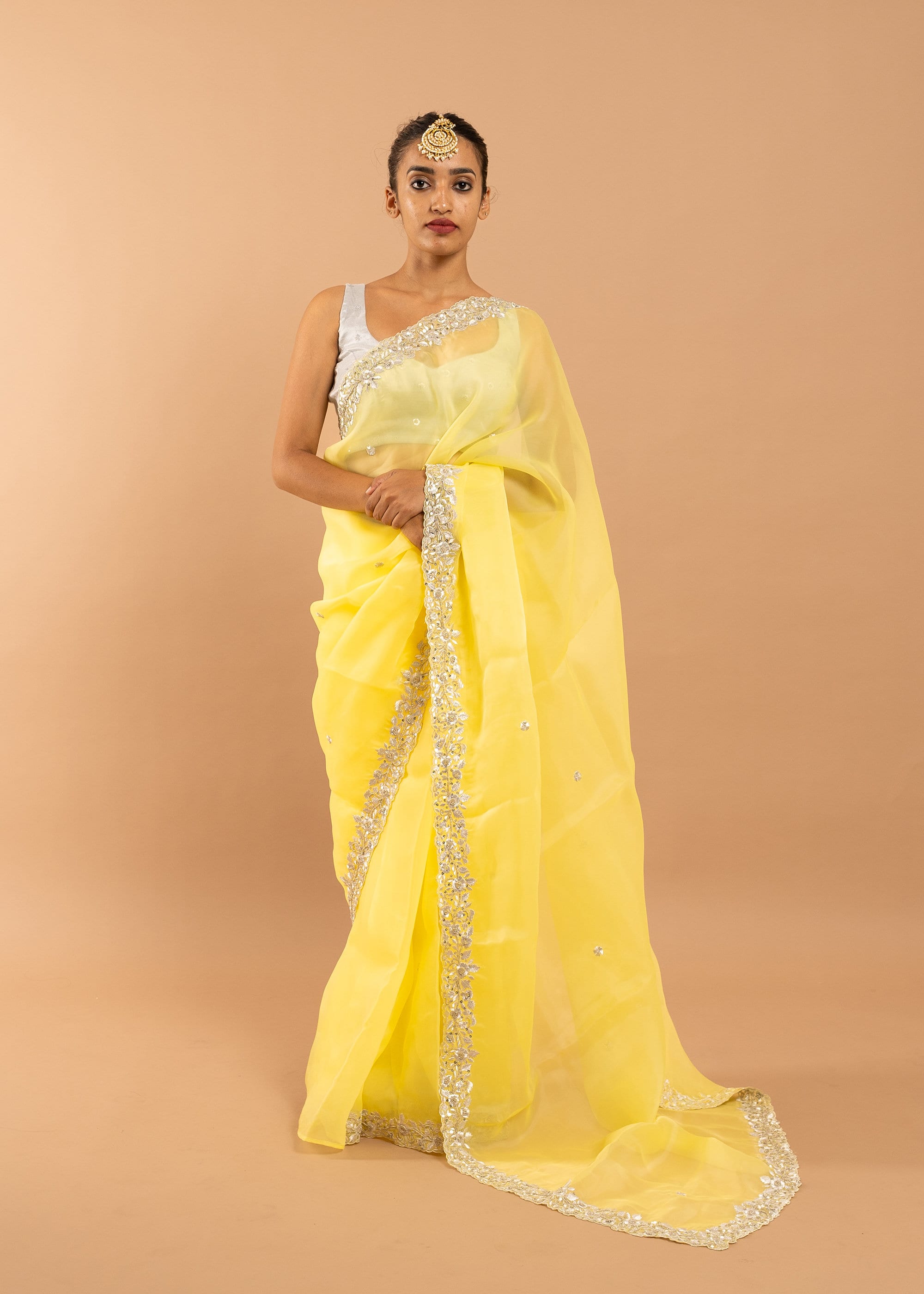 Yellow organza saree with zari silk thread and beads handwork embroidery