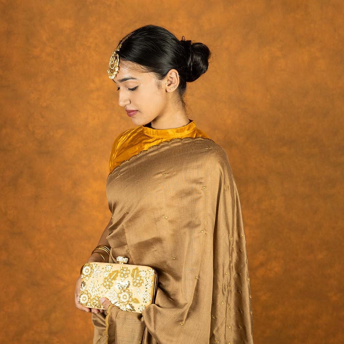 Cinnamon brown silk blend embroidered saree