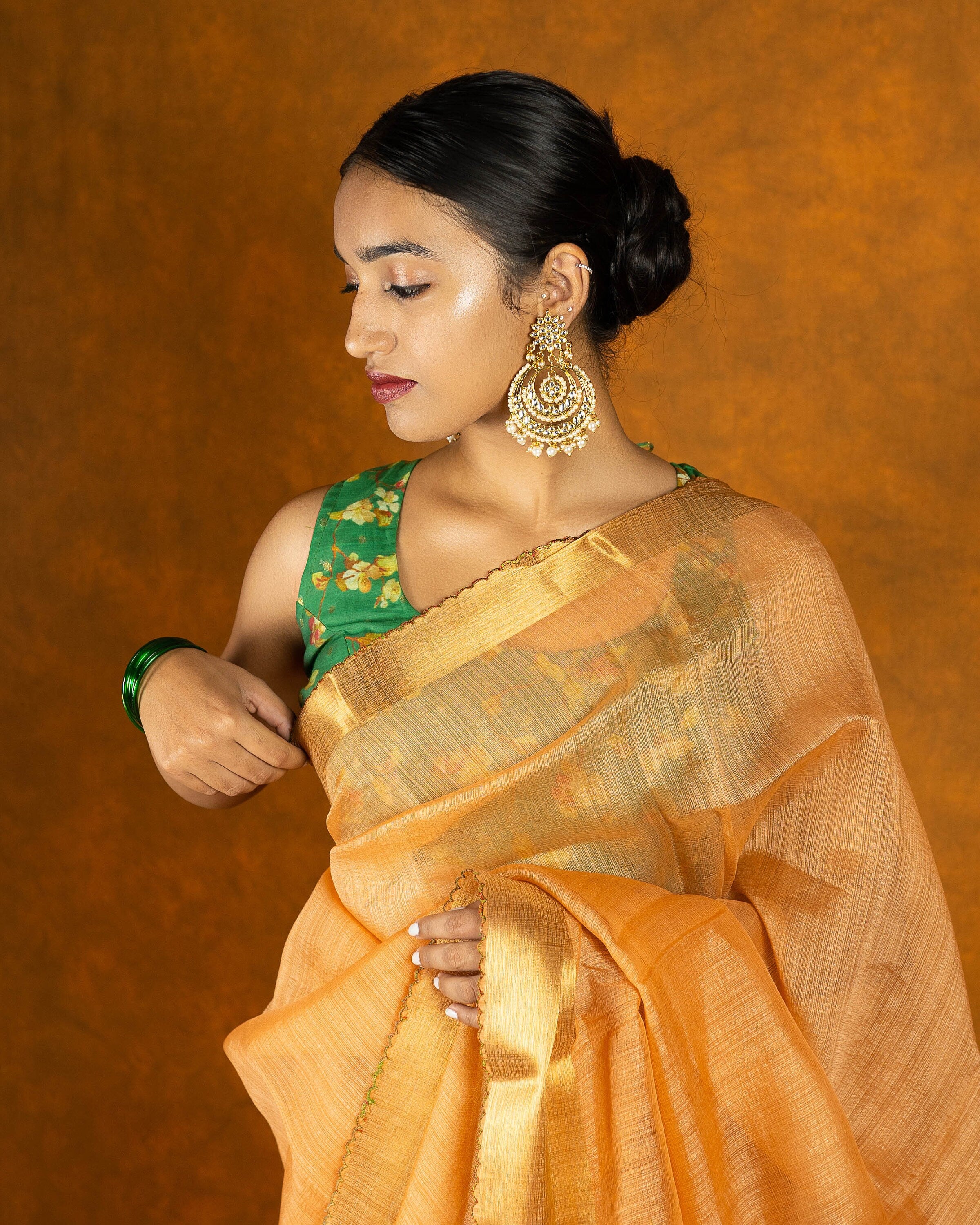 Peach Orange embroidery mirror-work saree with gold border and tassels