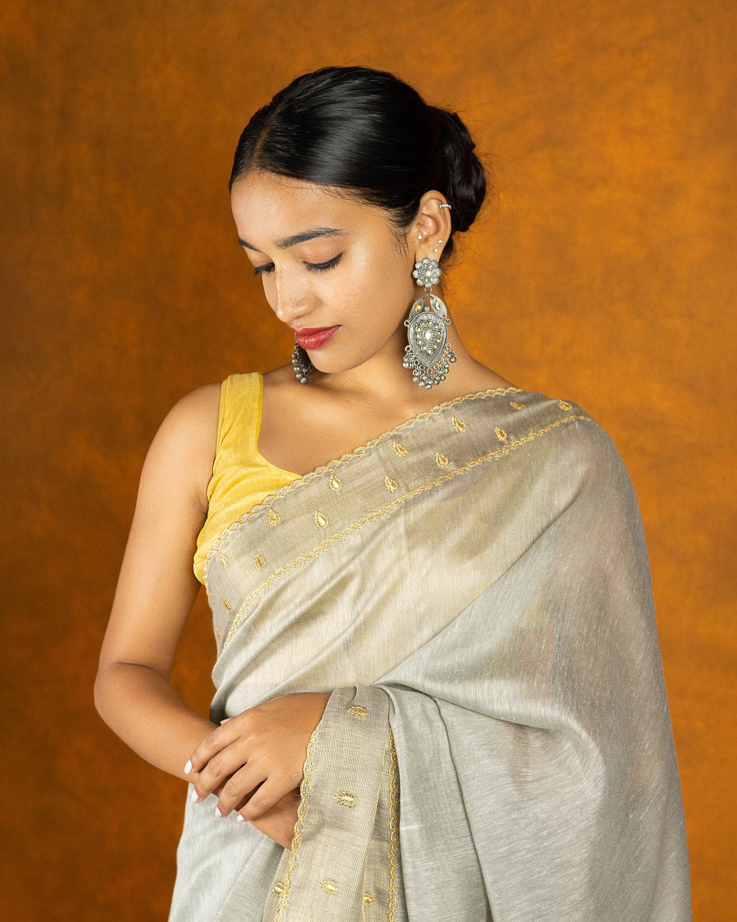 Gray cotton embroidery saree with gold work borde