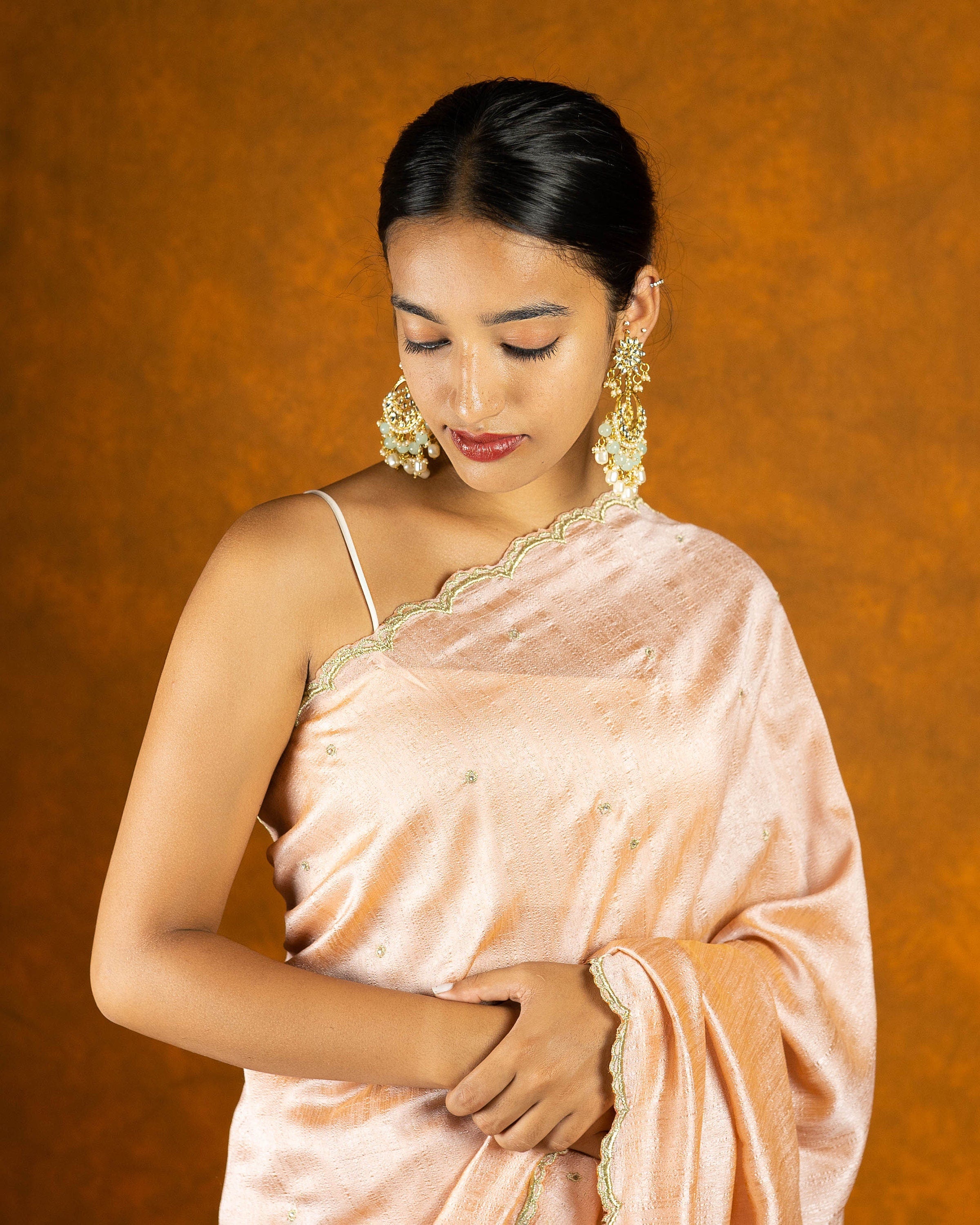 Peach chinon silk blend embroidery saree with crystal  and butta work border