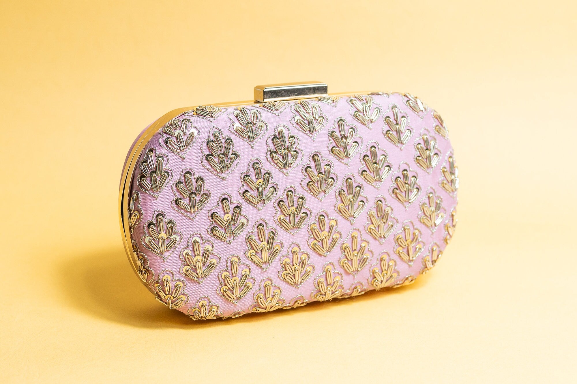 Pink metal embroidery clutch bag with detachable sling