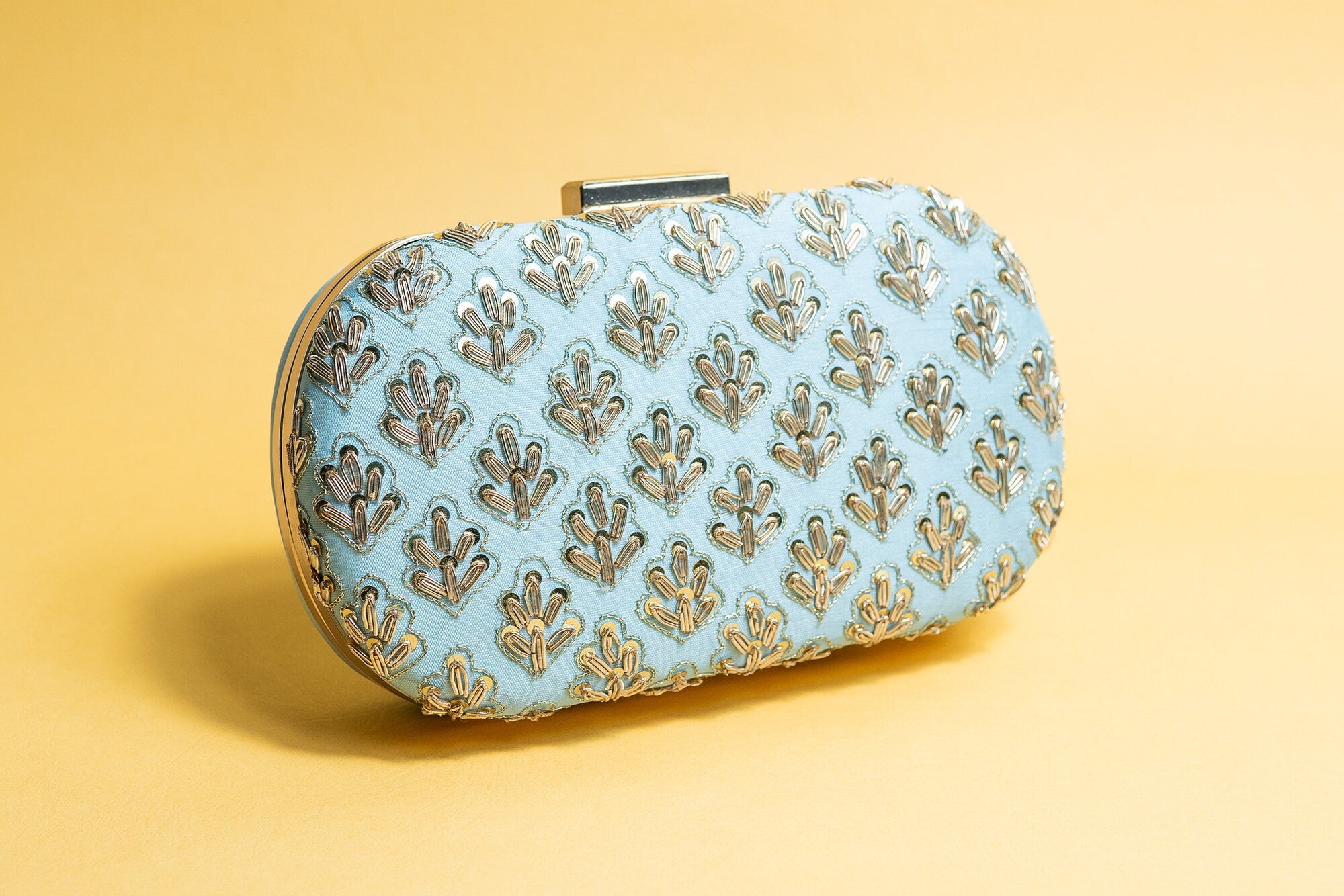 Powder blue metal embroidery clutch bag with detachable sling