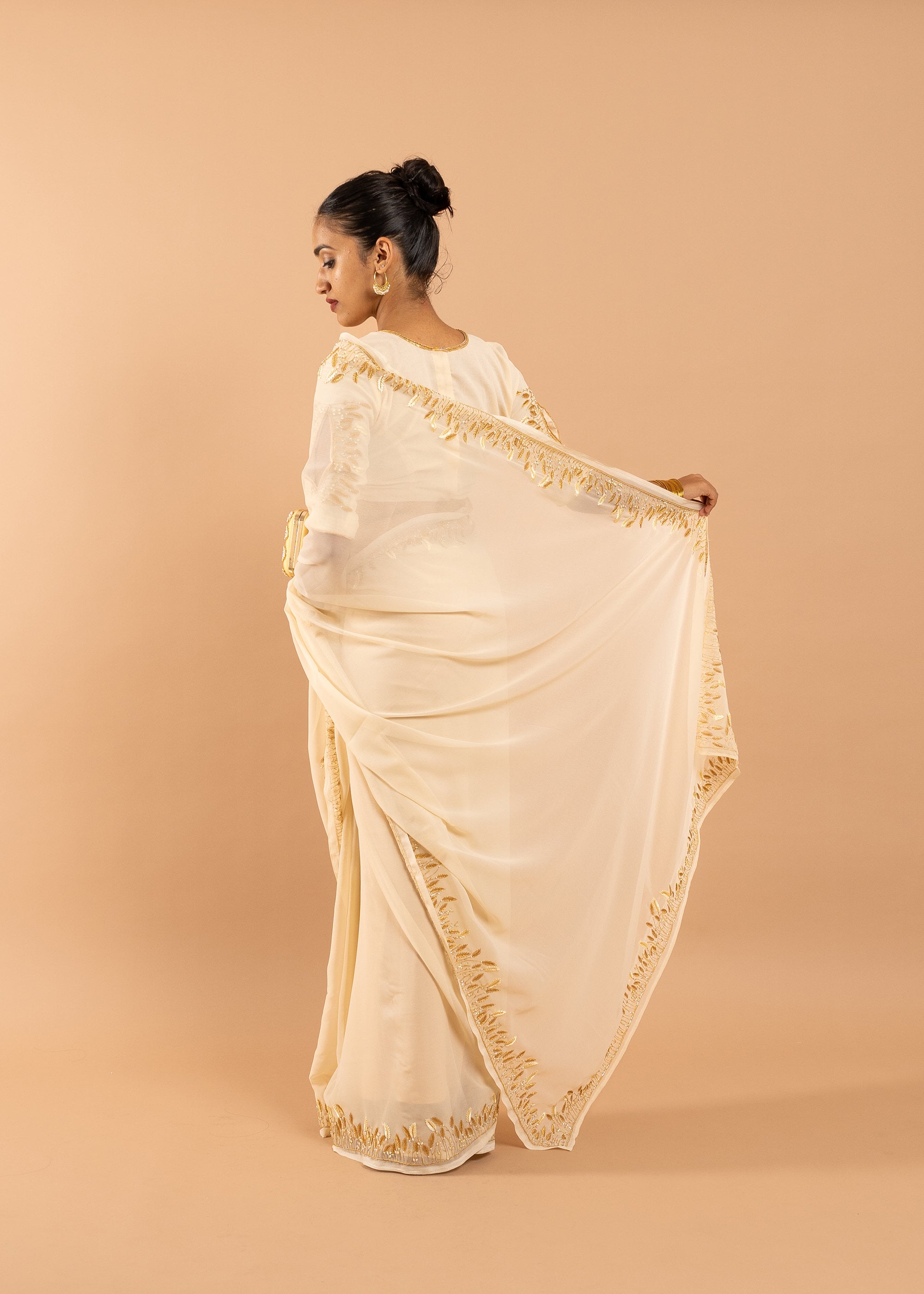 Cream georgette saree with silk thread  and beads handwork embroidery