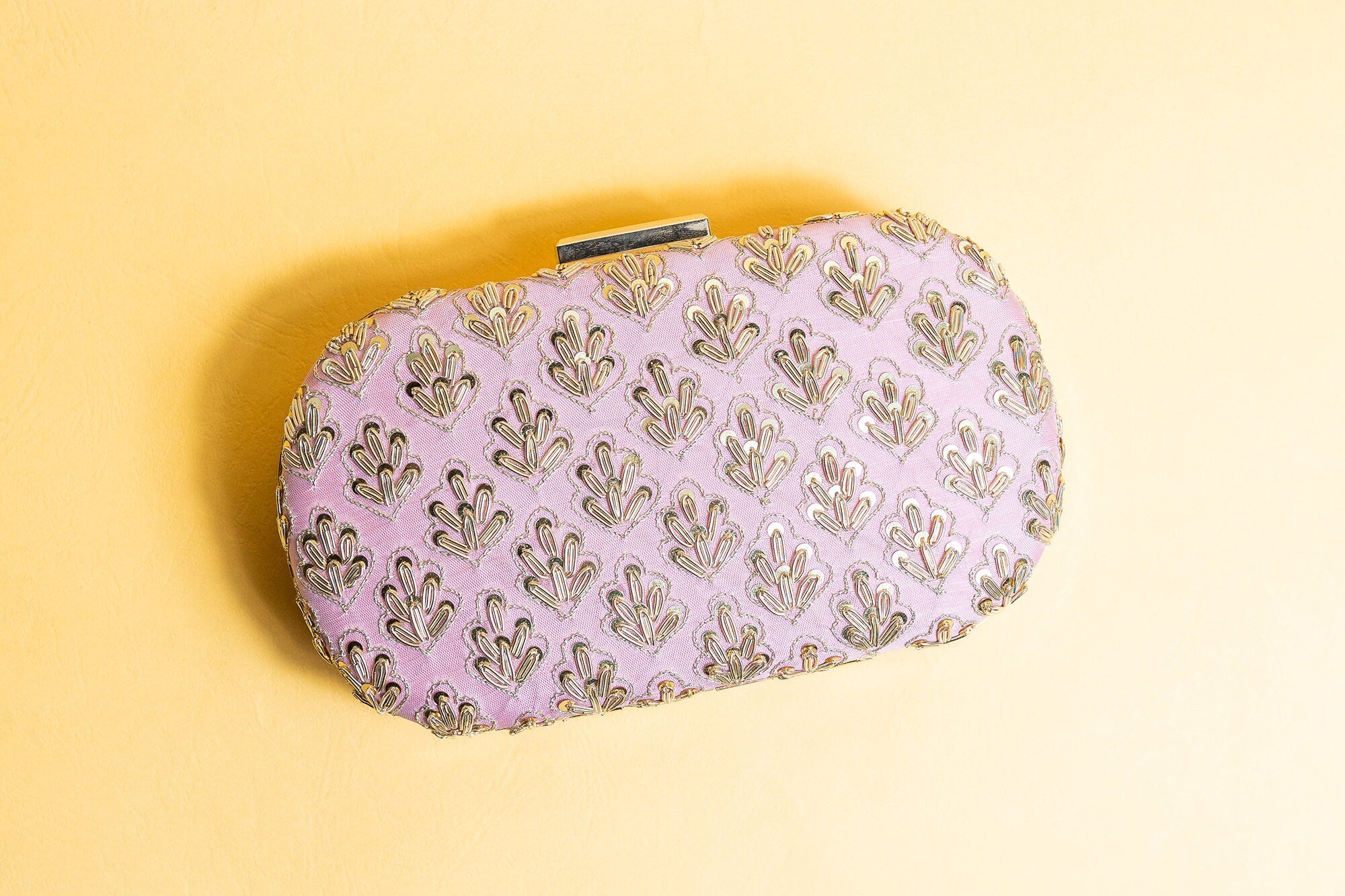 Pink metal embroidery clutch bag with detachable sling