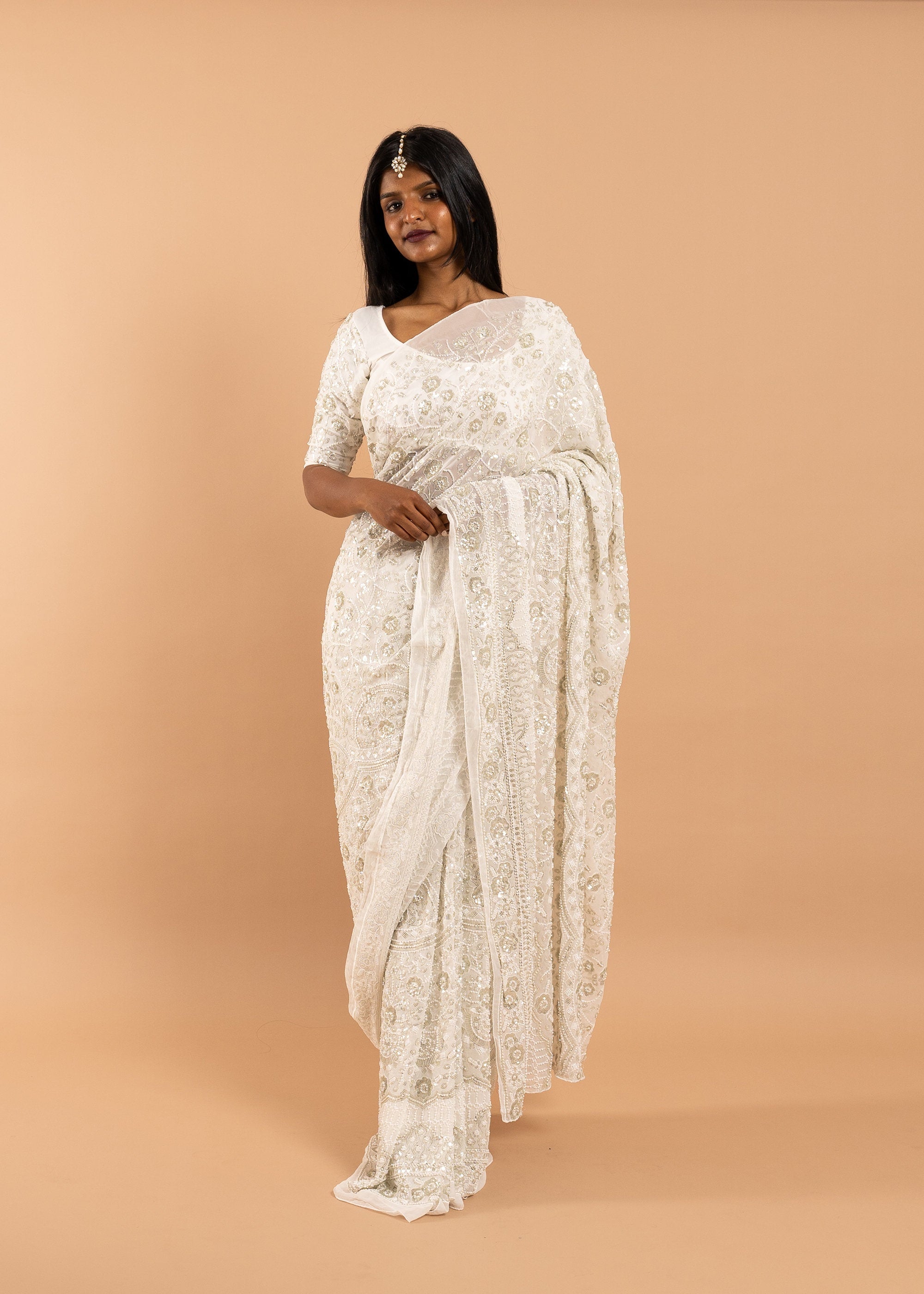 Ivory Georgette saree with white silk thread  and sequins handwork embroidery